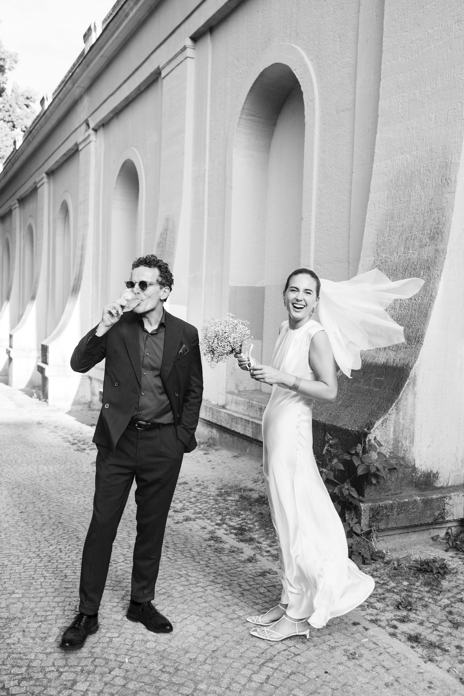 Cool wedding couple laughing