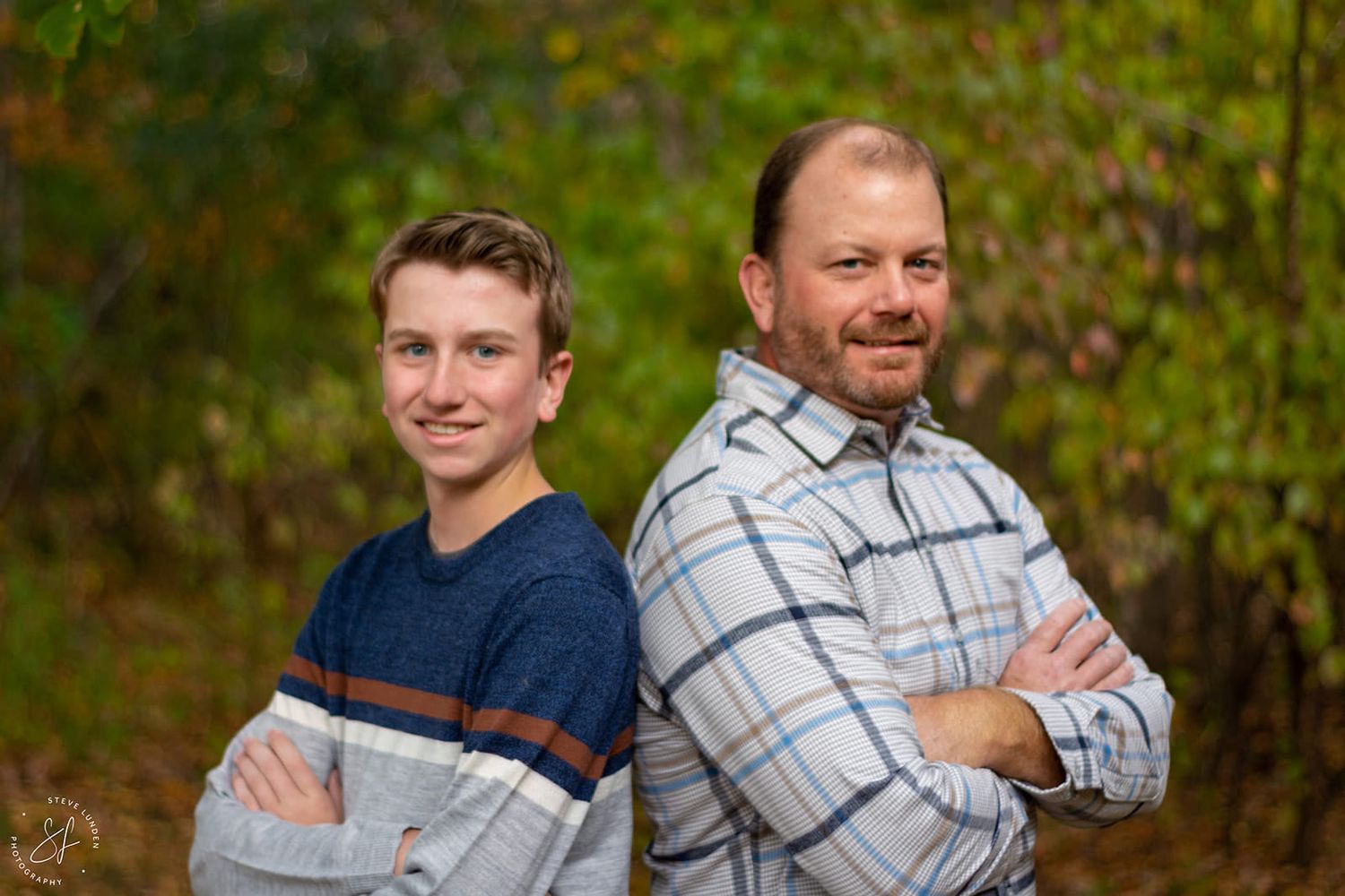 father and son posing together