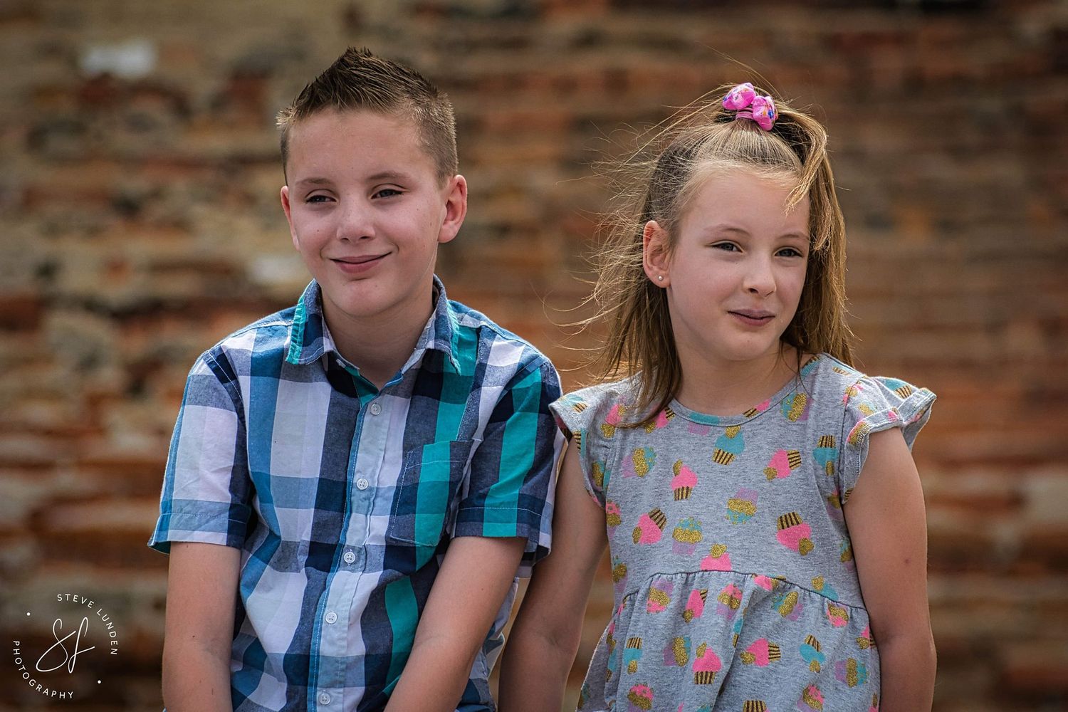 young boy and girl posing together