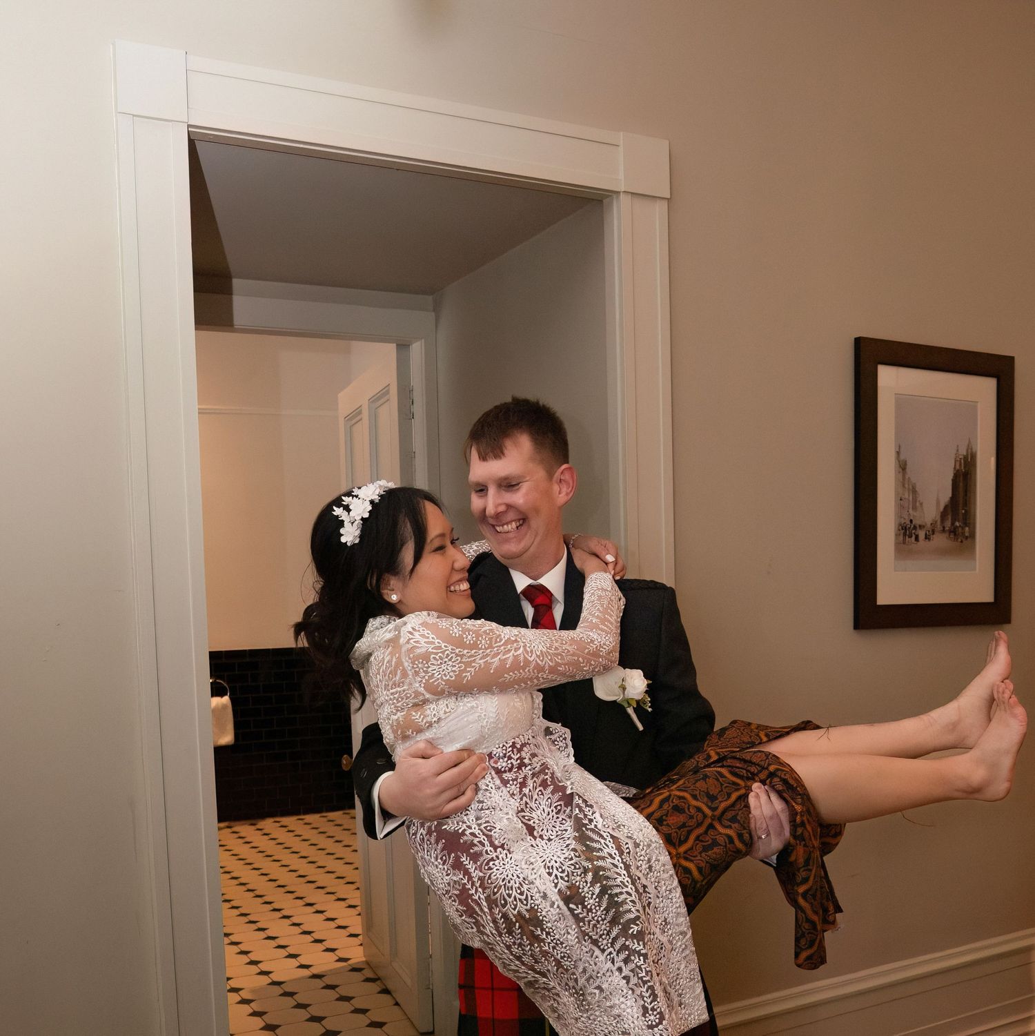 Time lapse series capturing a couple dancing, spinning and laughing in a hotel hallway.