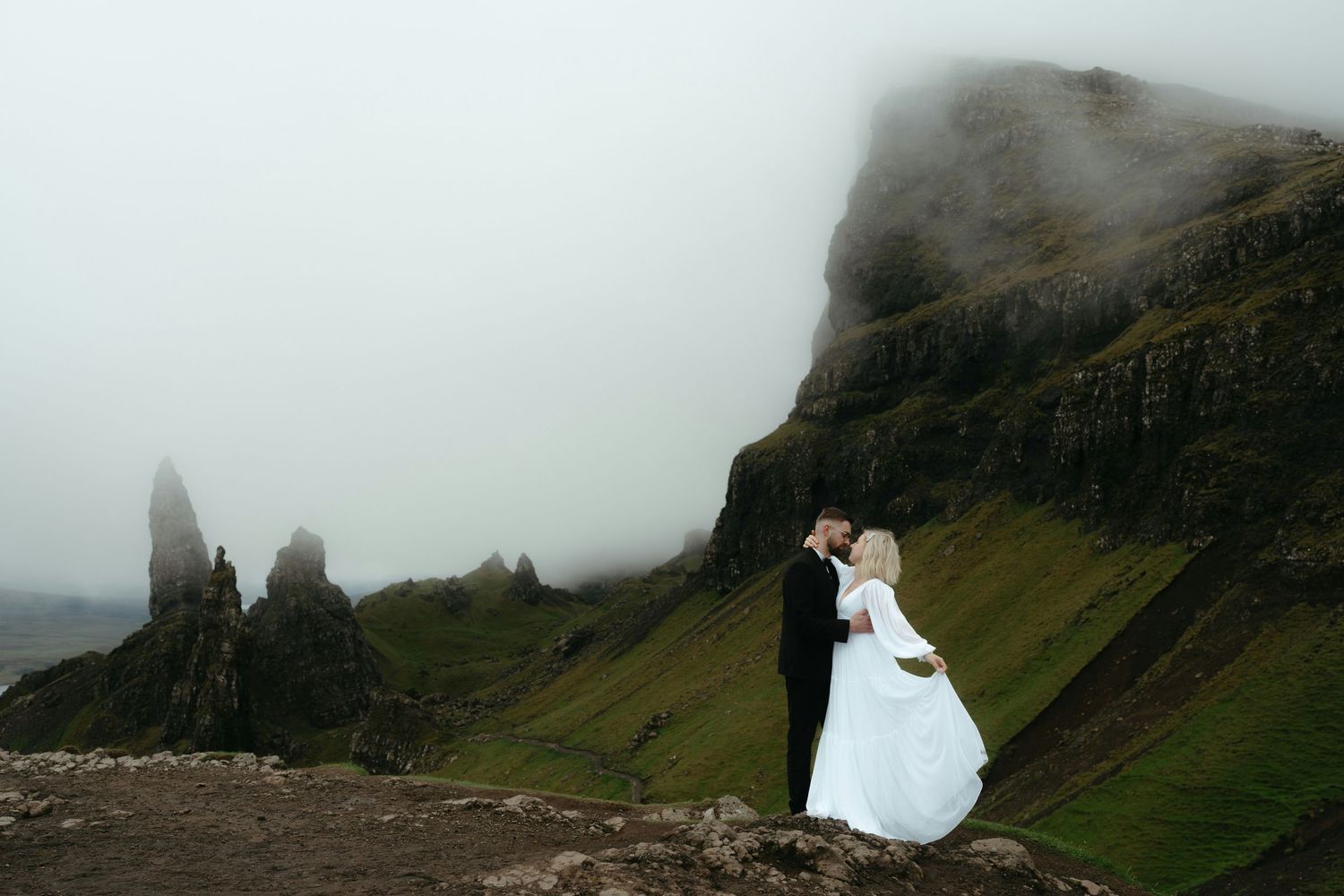 A series of dramatic misty mountain landscapes with towering cliffs and coastal views in Scotland.