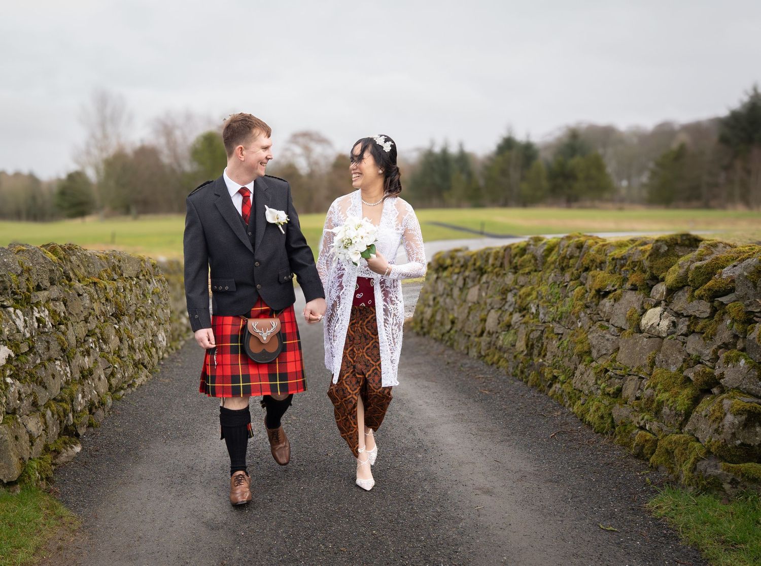 Six Scottish wedding photos showing traditional kilts and bride in white gown walking along stone wall lined path.