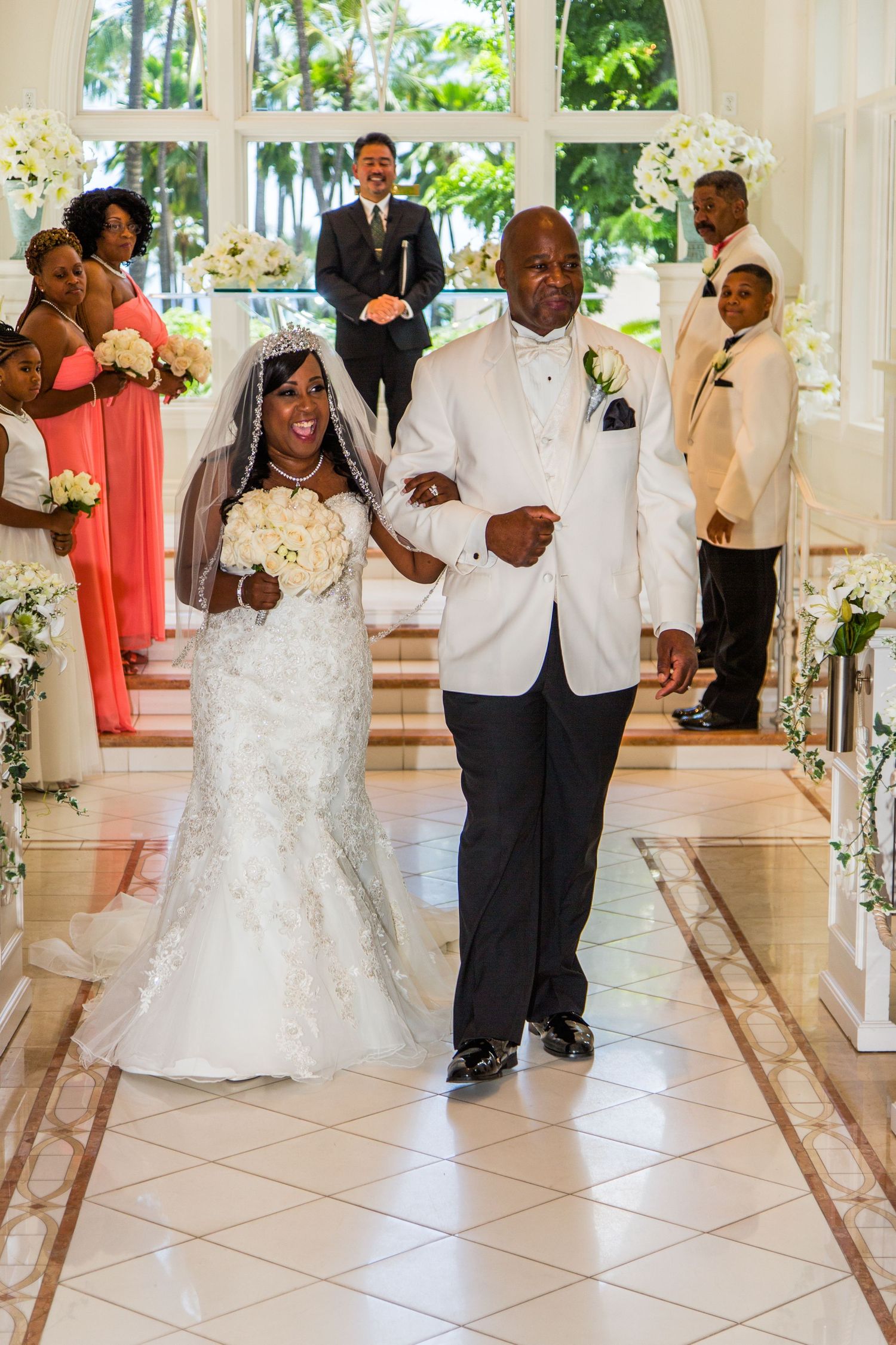 Wedding ceremony in the Akala Chapel of the Hilton Hawaiian Village hotel in Honolulu with floral decorations.