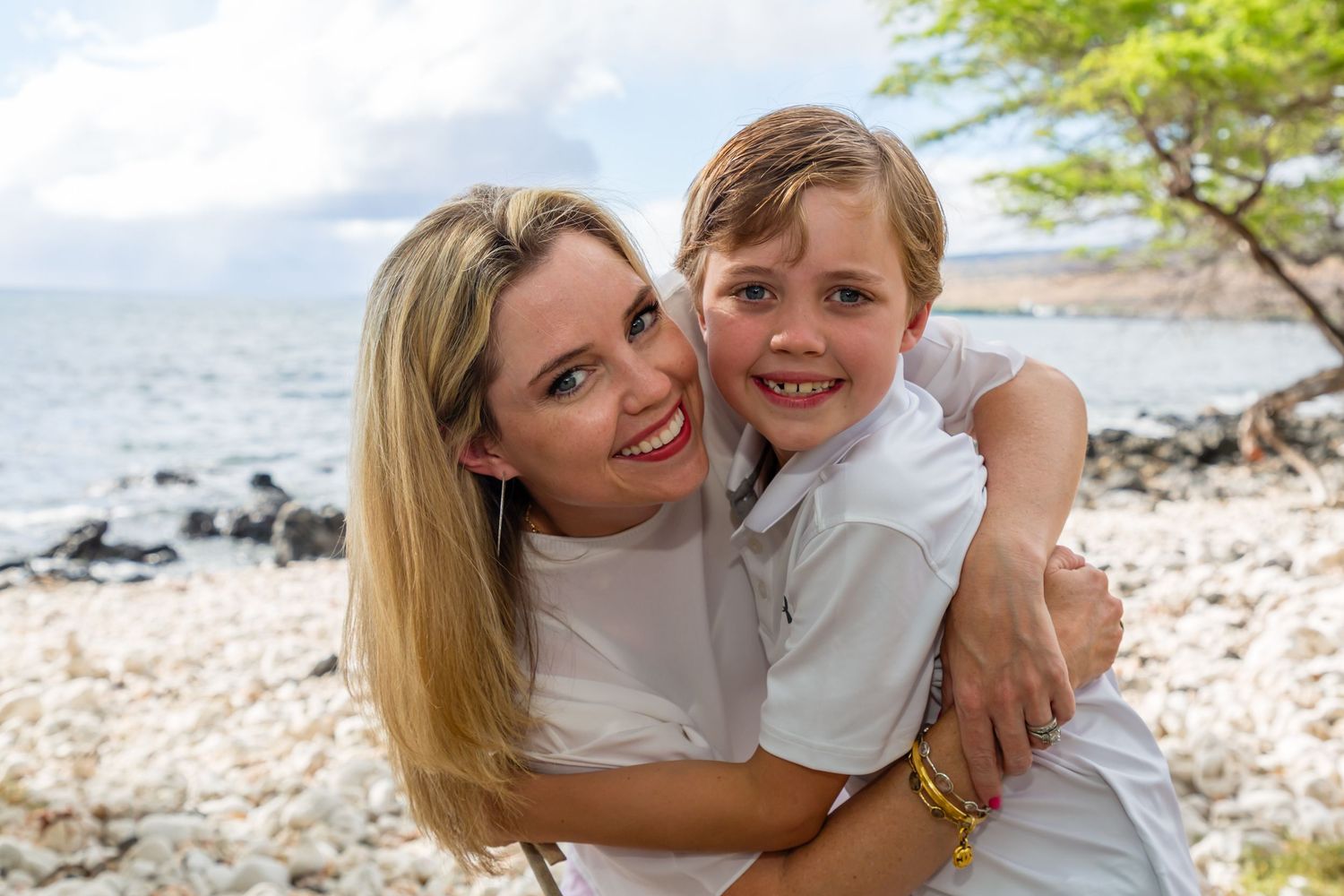 Mother and young child portarei9t sharing a joyful moment at the Old Airport Beach Park in Kailua Kona, Hawaii