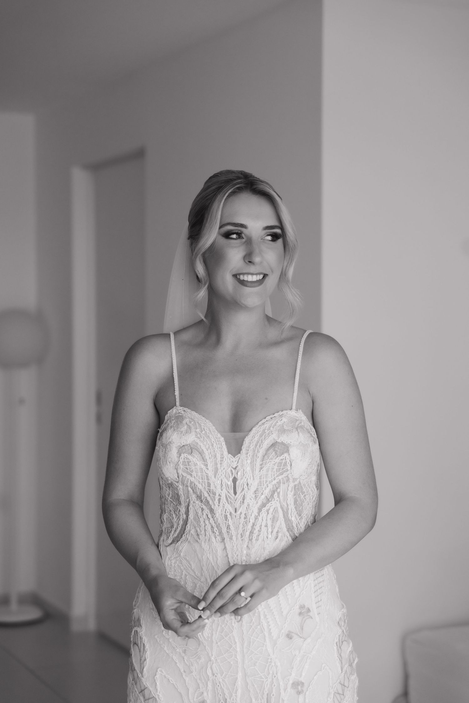 Classic black and white bridal portrait featuring lace wedding gown.