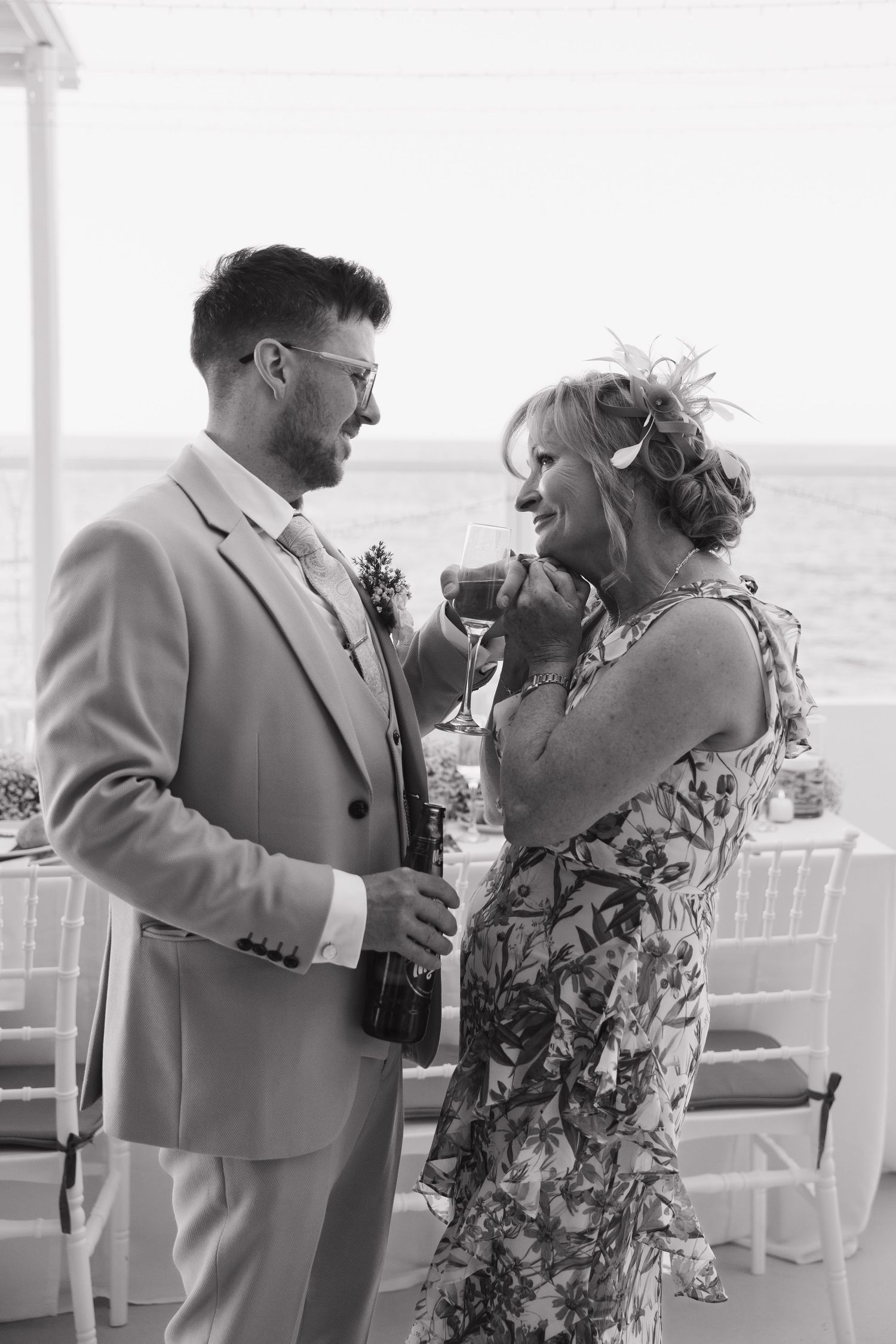 Wedding couple shares emotional first dance moment by the seaside.