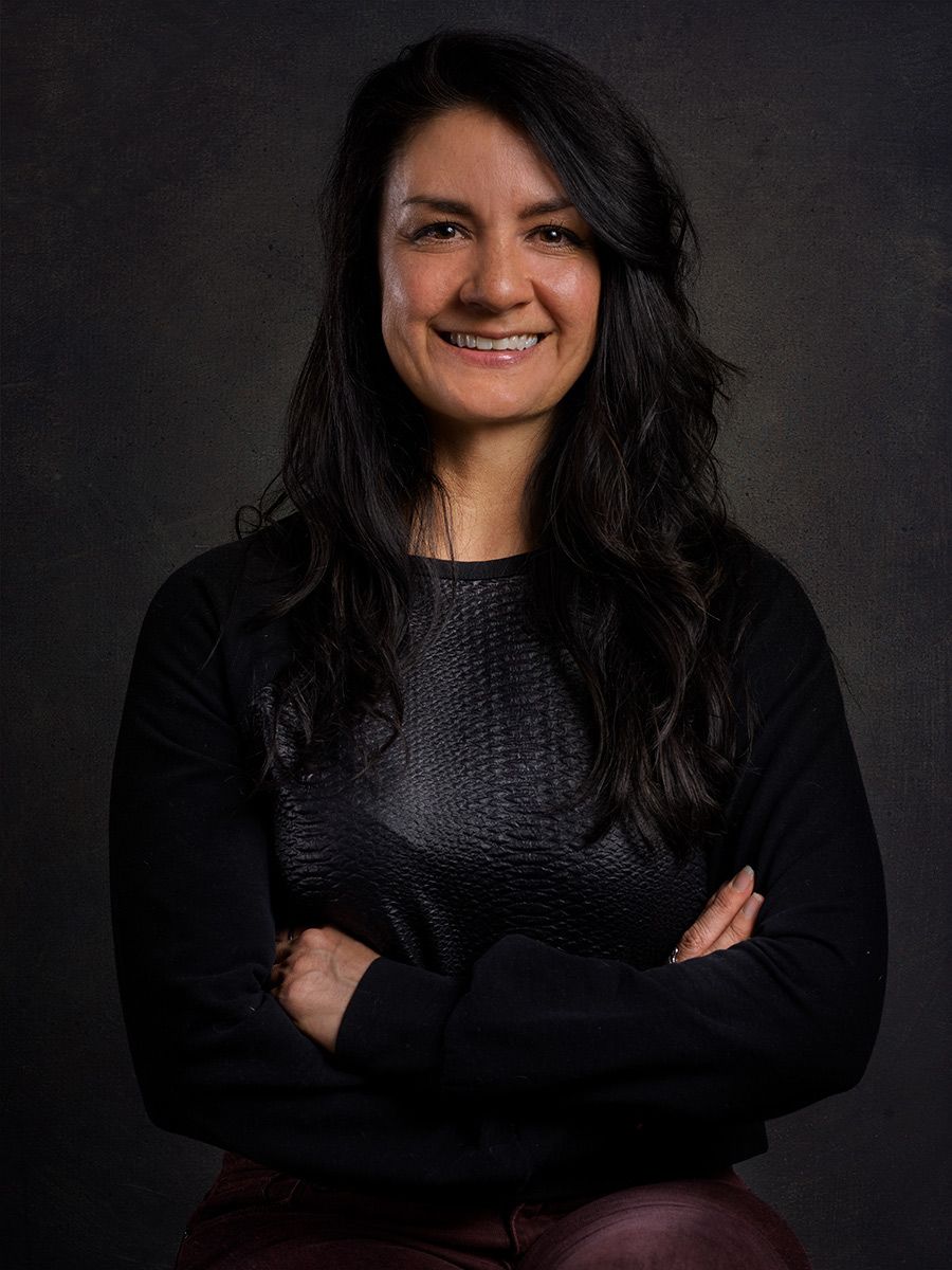 Editorial-style headshot of a woman captured in a studio setting