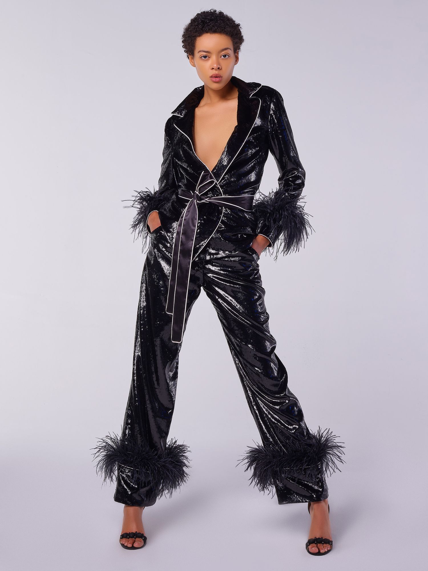 High-end fashion photograph against a minimalist backdrop, photographed by JJ Constantine.