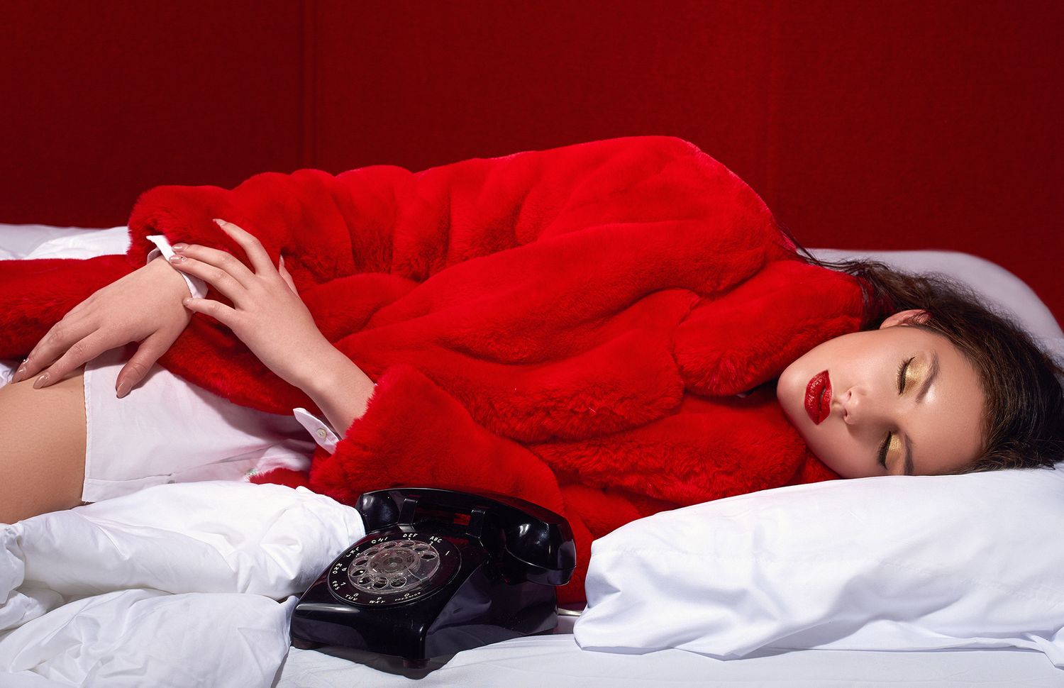 Dramatic red bedtime scene with rotary phone and vintage styling.