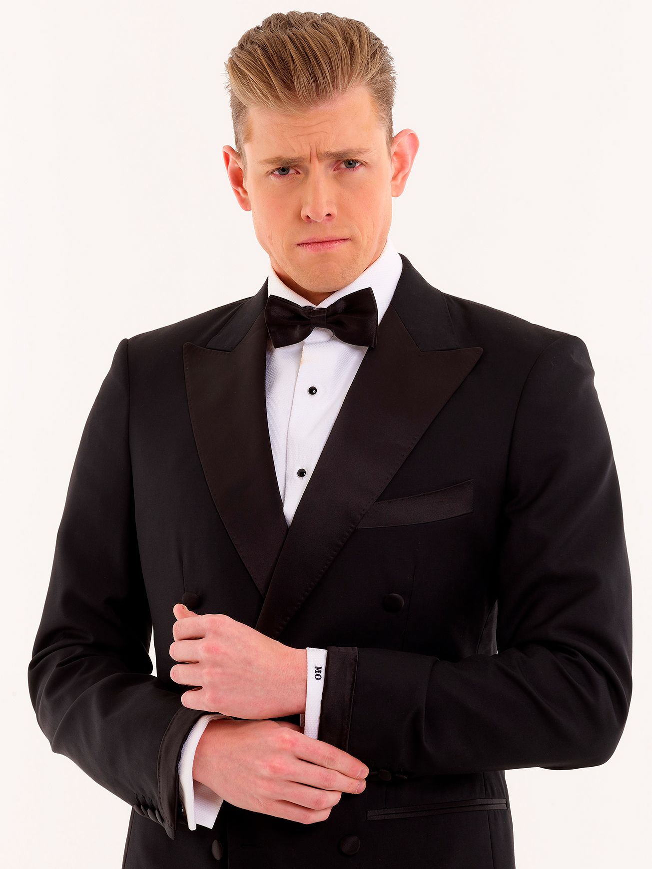 High-contrast portrait of male entrepreneur looking directly at camera