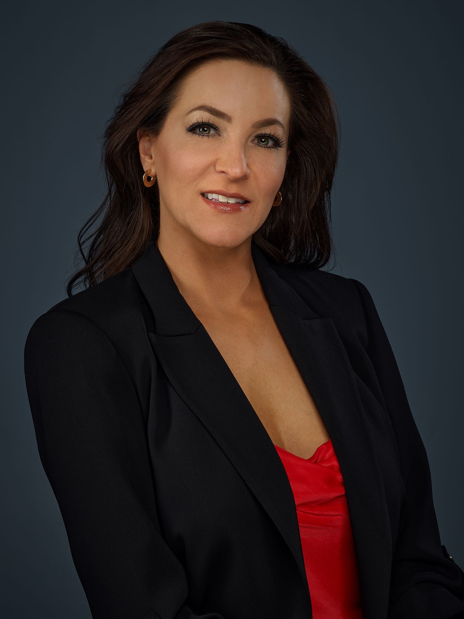 Classic business headshot of a woman with direct eye contact