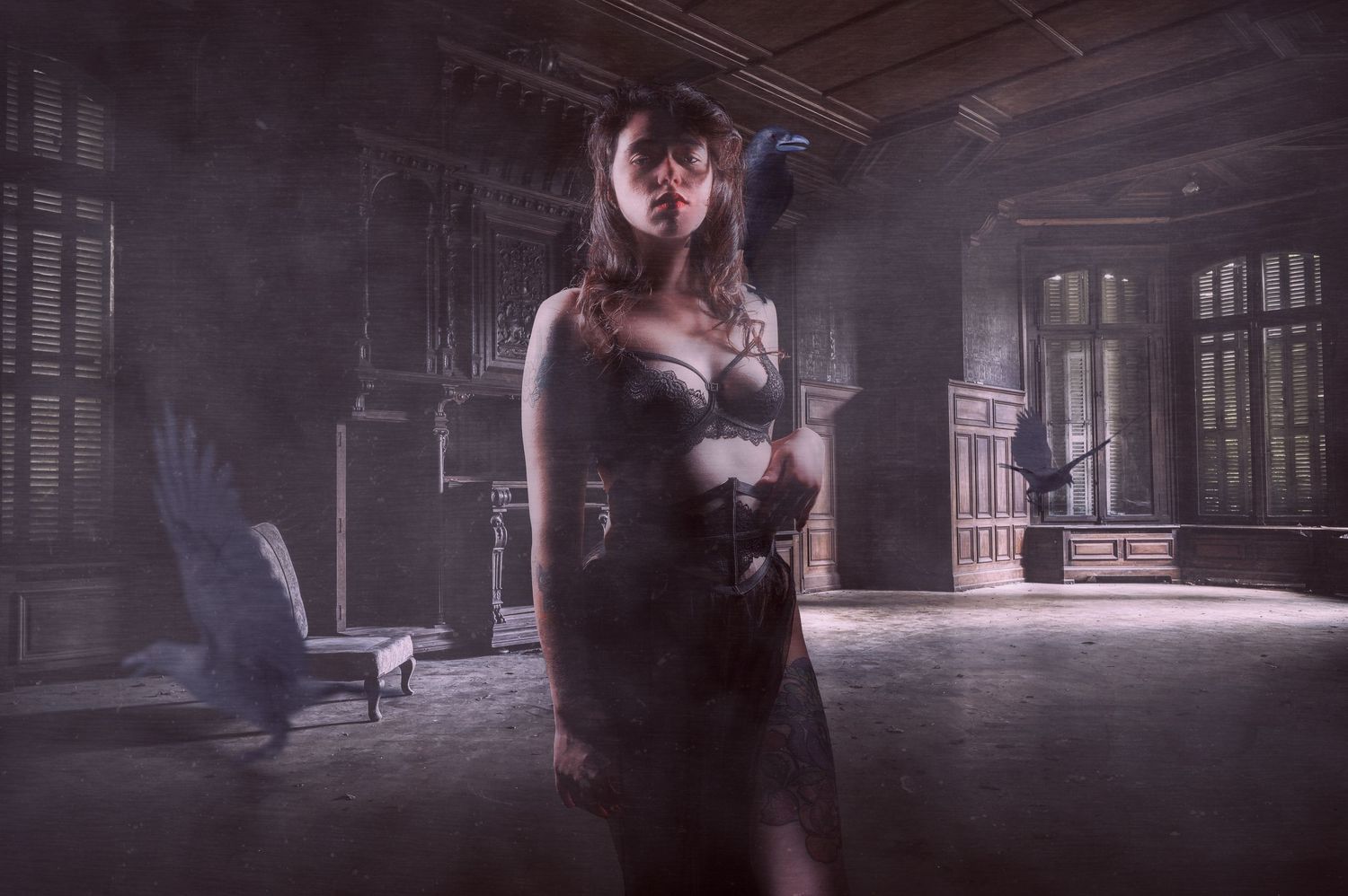 Atmospheric portrait in abandoned building with dramatic fog and moody lighting.
