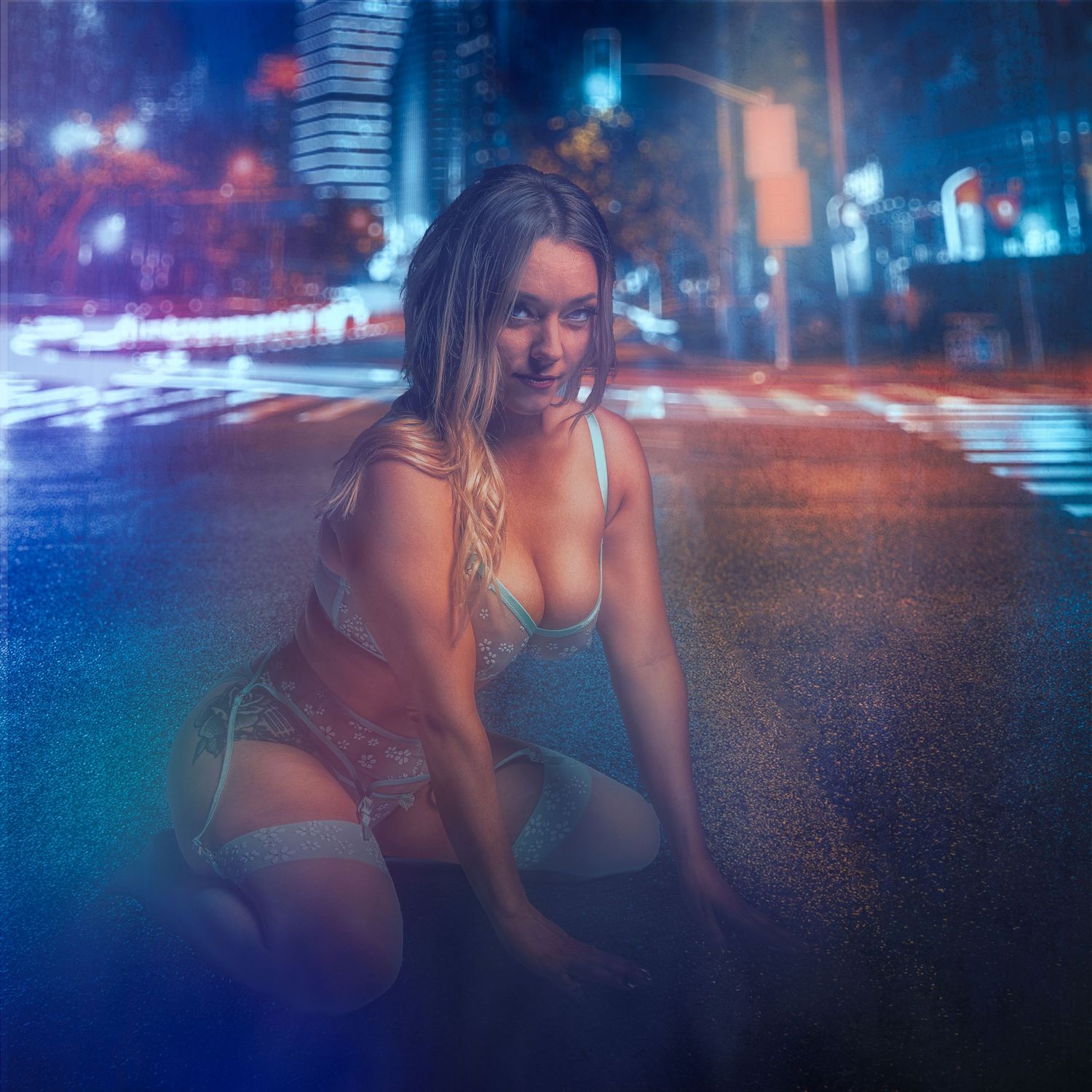 Urban nighttime scene with neon lights reflecting off wet city streets.