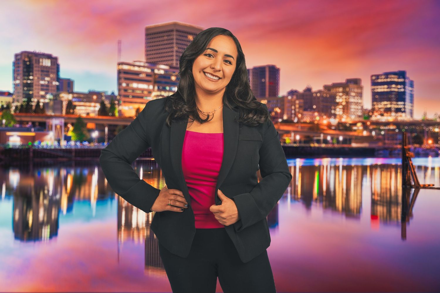 Professional portrait against vibrant cityscape with reflecting water and sunset sky.