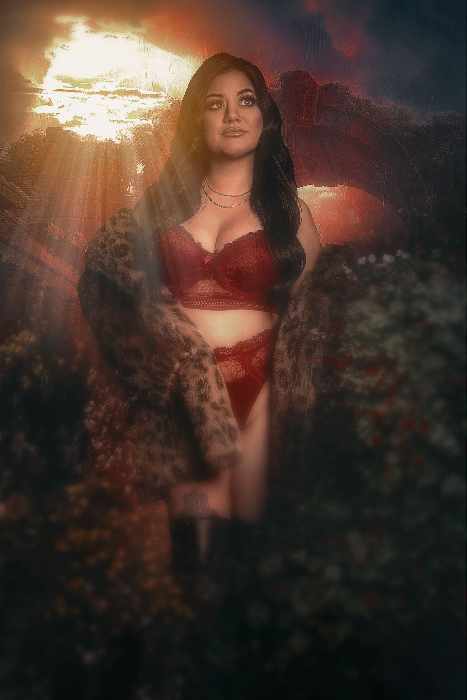 Dreamy sunset portrait with dramatic lighting and mountain backdrop in red lingerie.