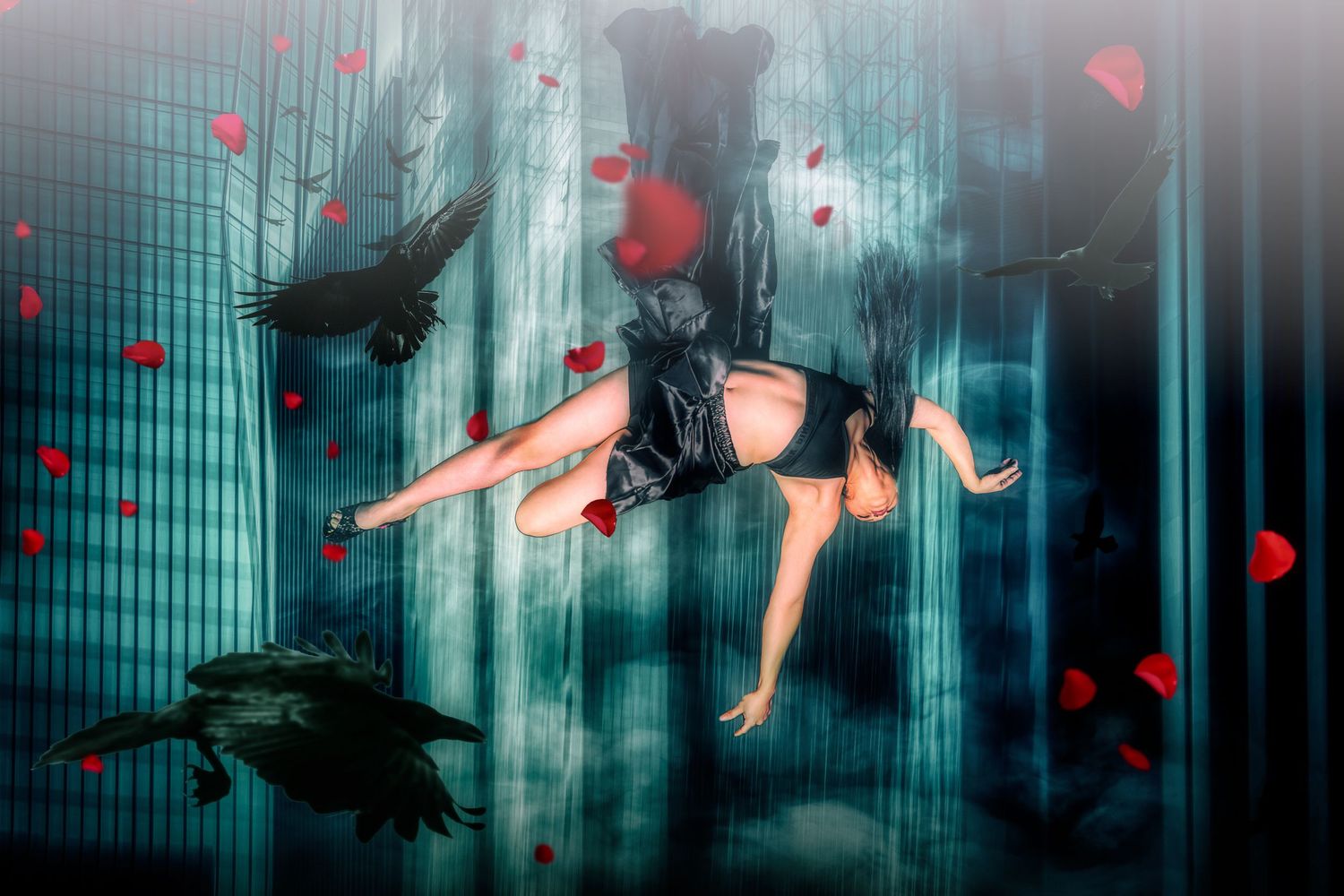 Floating figure in black outfit surrounded by red petals in ethereal underwater scene.