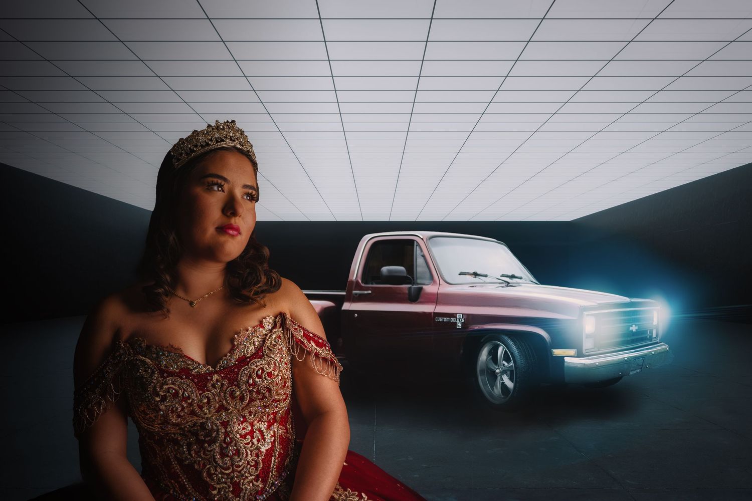 Glamorous formal portrait with vintage car in modern industrial setting.