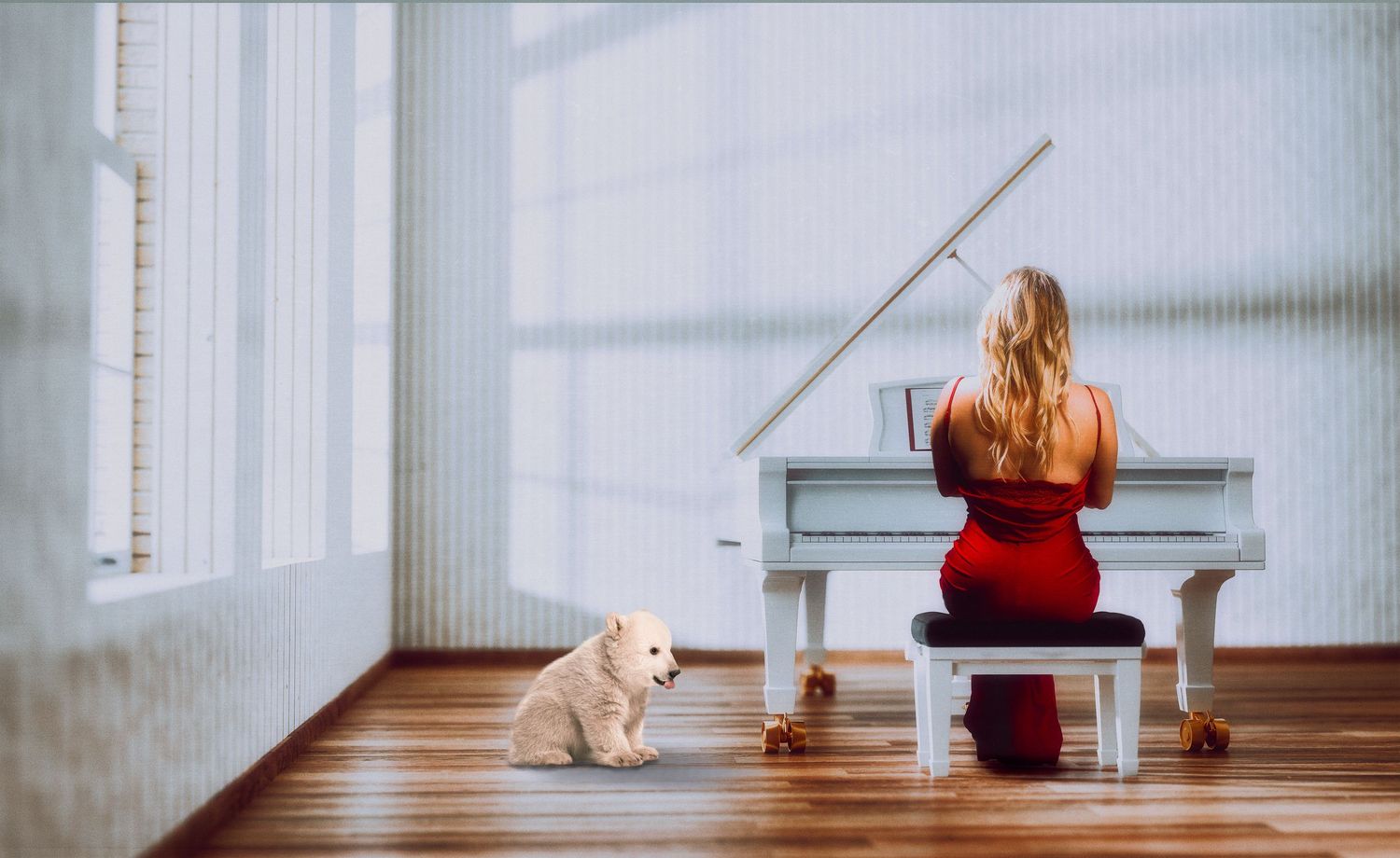 Woman in red dress playing piano with cat sitting nearby in bright minimalist room.