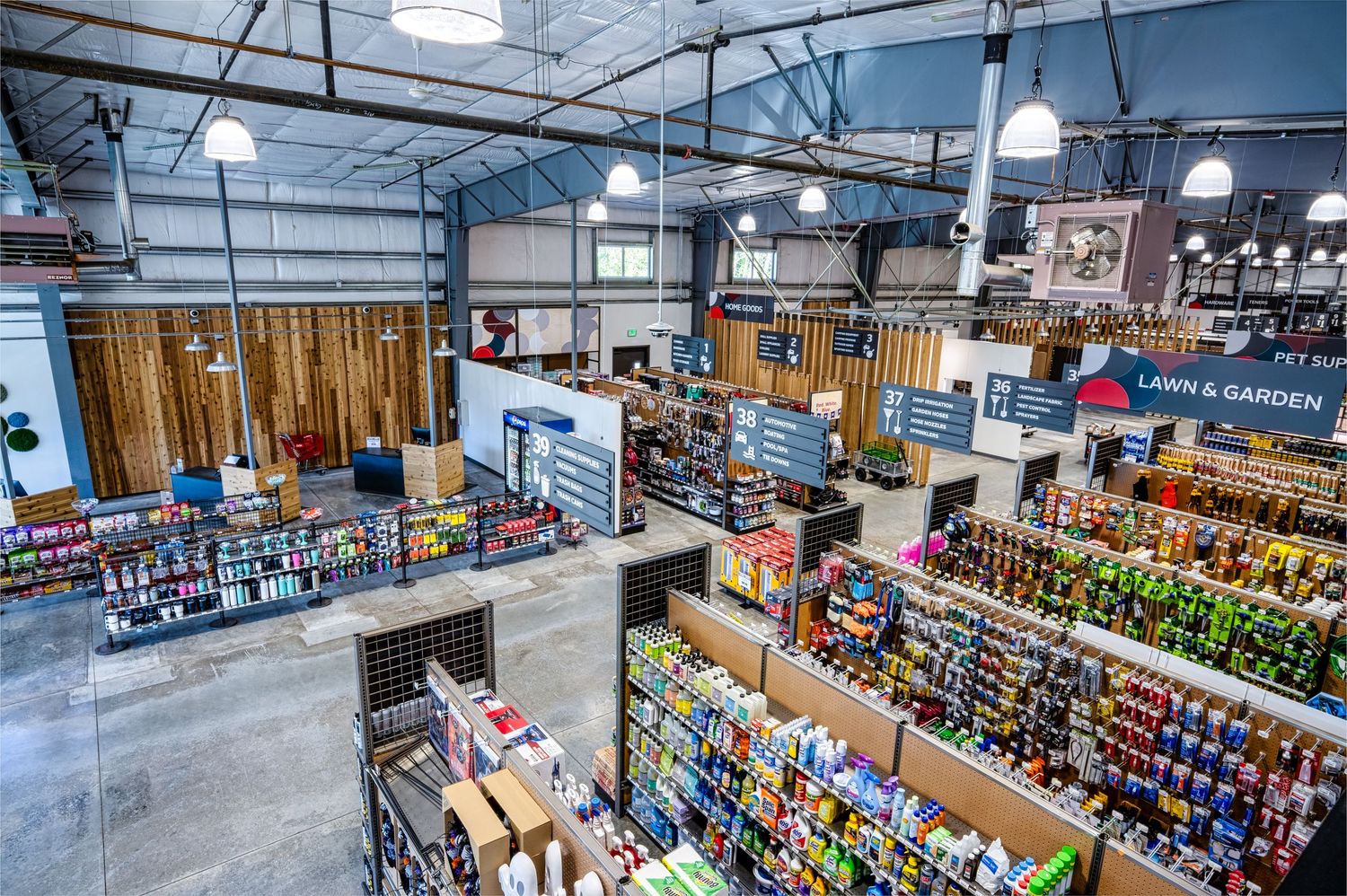 Aerial view of retail store interior showing product aisles and overhead lighting.