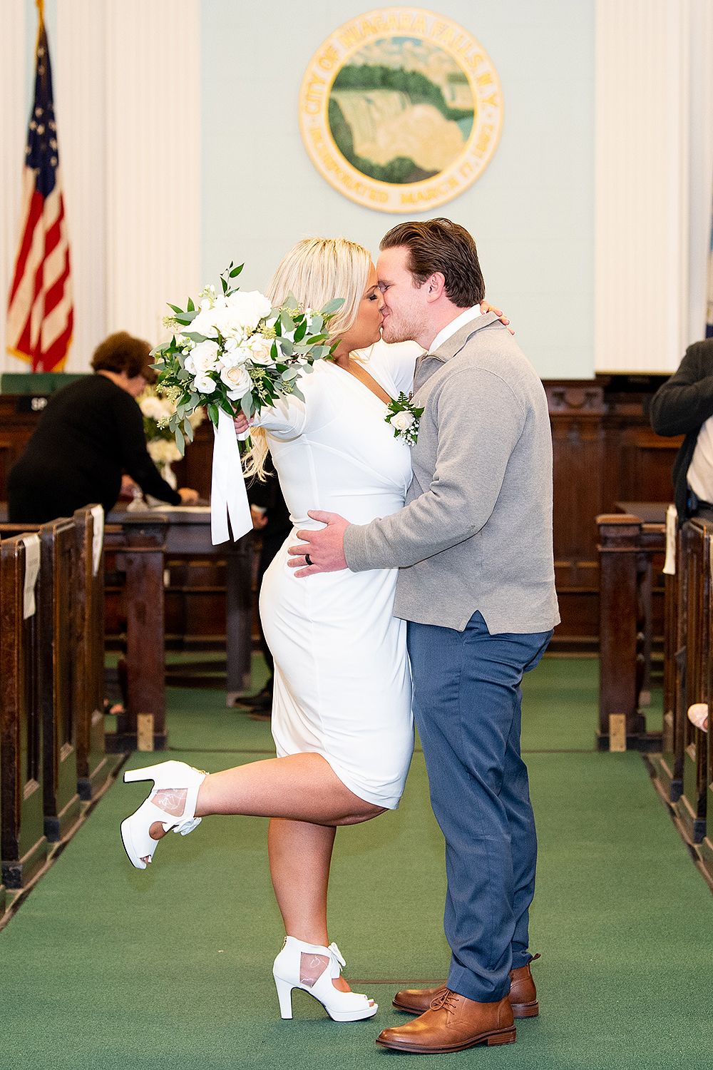 Sequence of wedding photos showing playful dip pose between couple on green carpet in church sanctuary.
