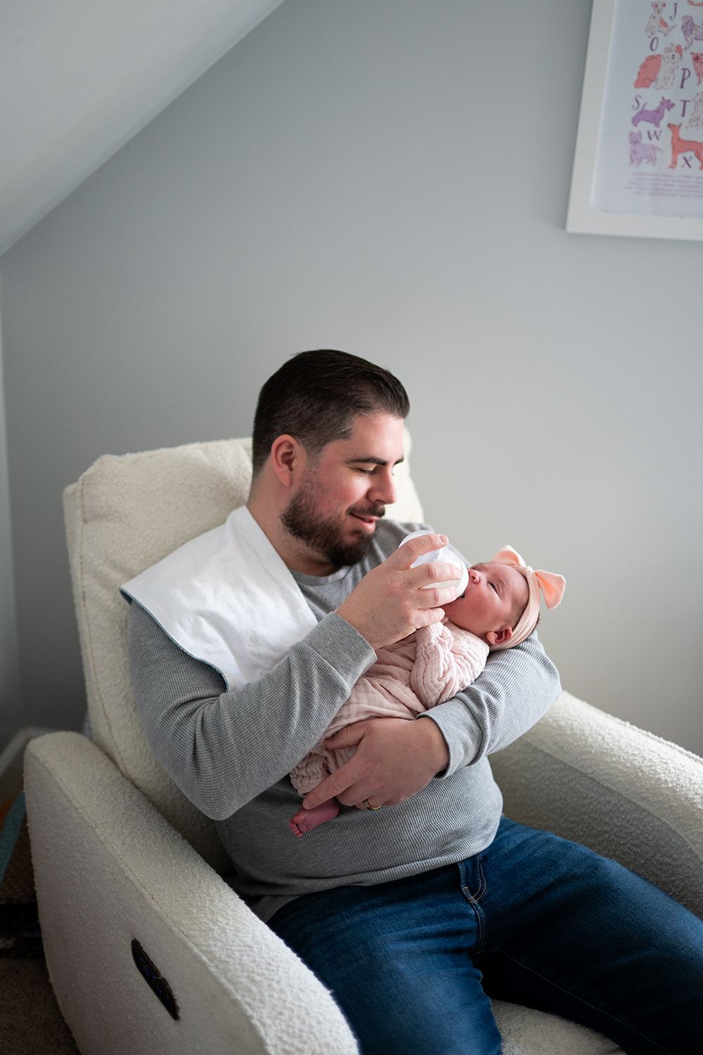 A sequence of photos showing an adult and infant sharing a tender moment while resting on a light-colored couch.