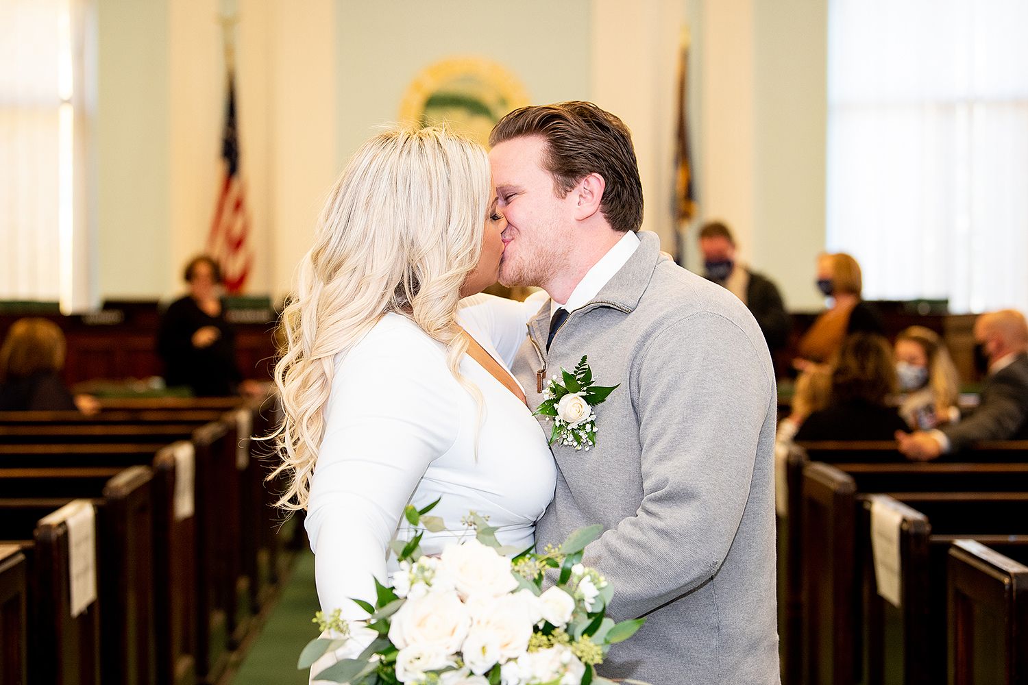 A wedding kiss sequence showing four progressive shots of a tender moment in a church setting.
