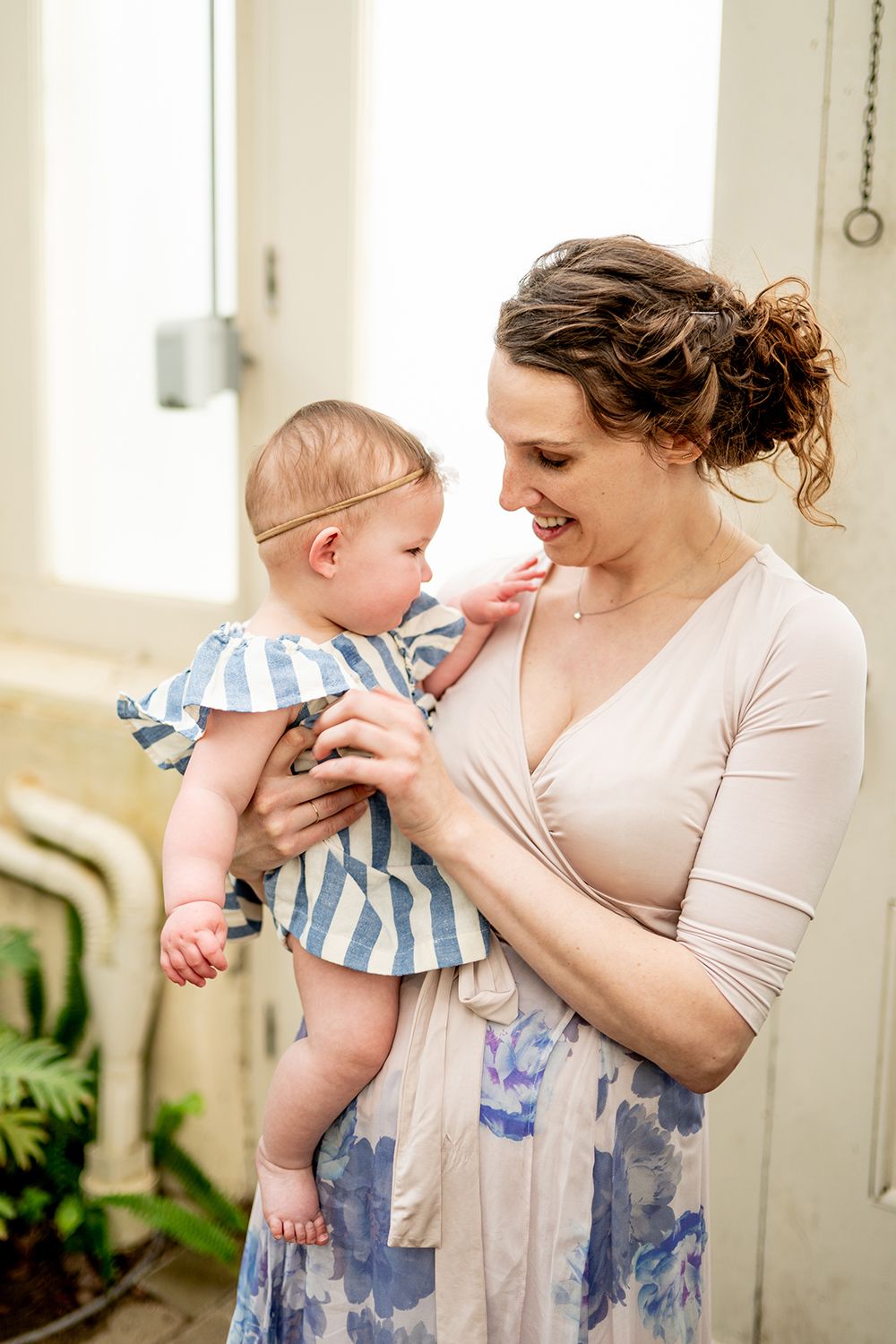 Series of tender moments shared in a light-filled room with white walls and natural daylight.