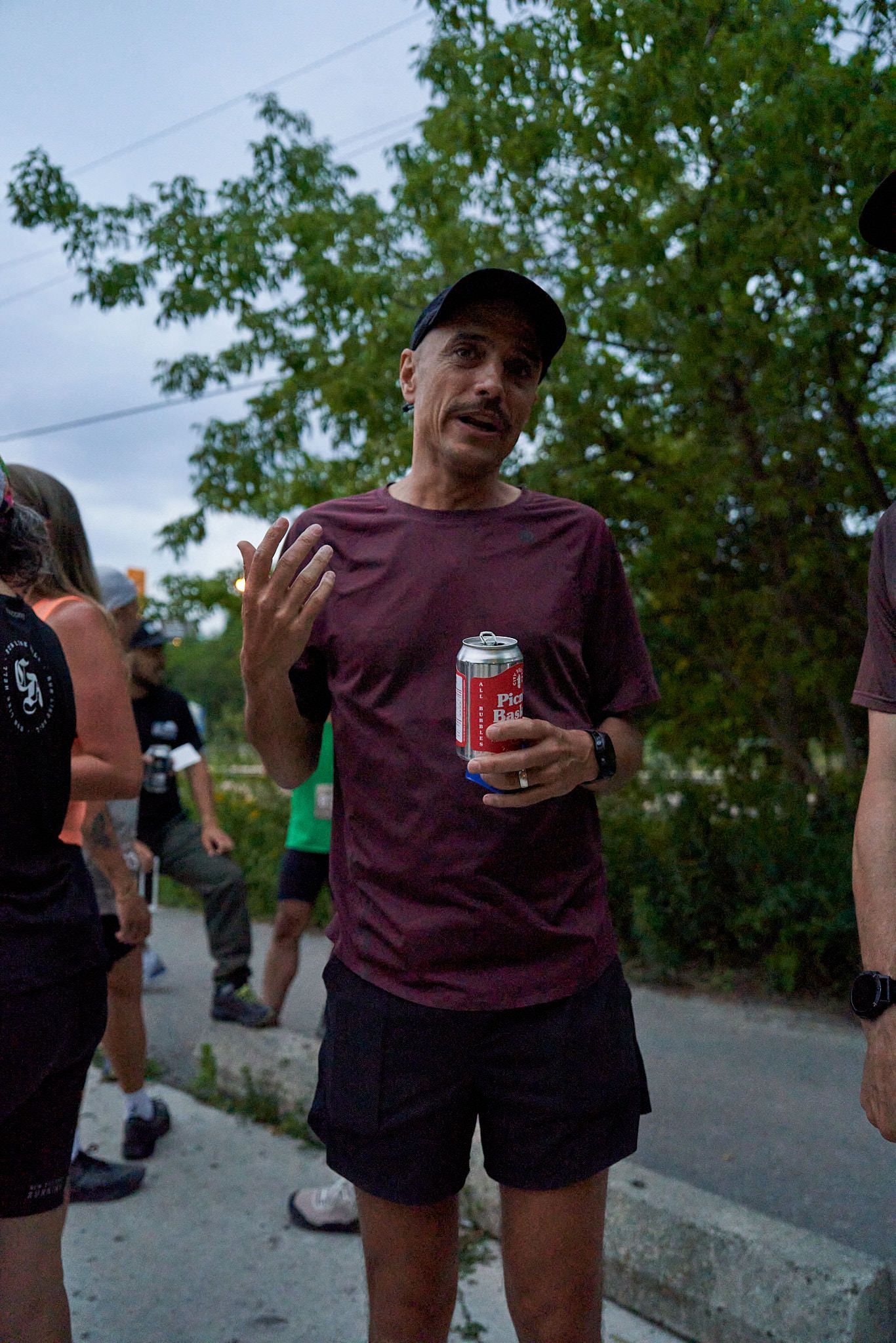 Runners cheering for others in a race in Canada