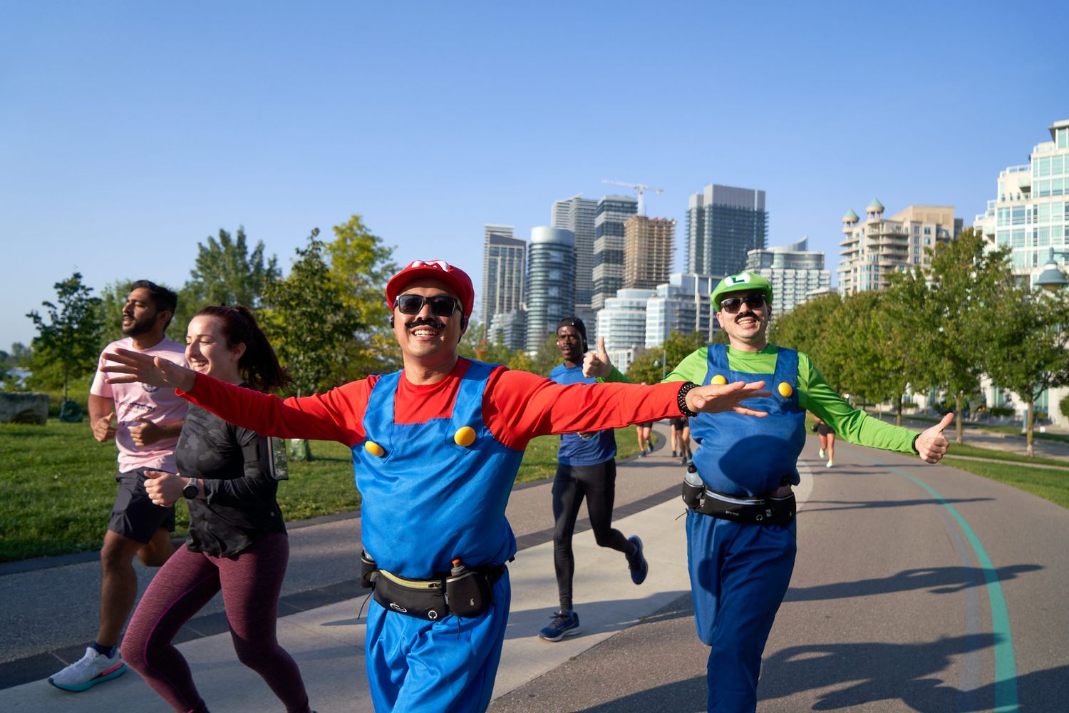 Runners cheering for others in a race in Canada