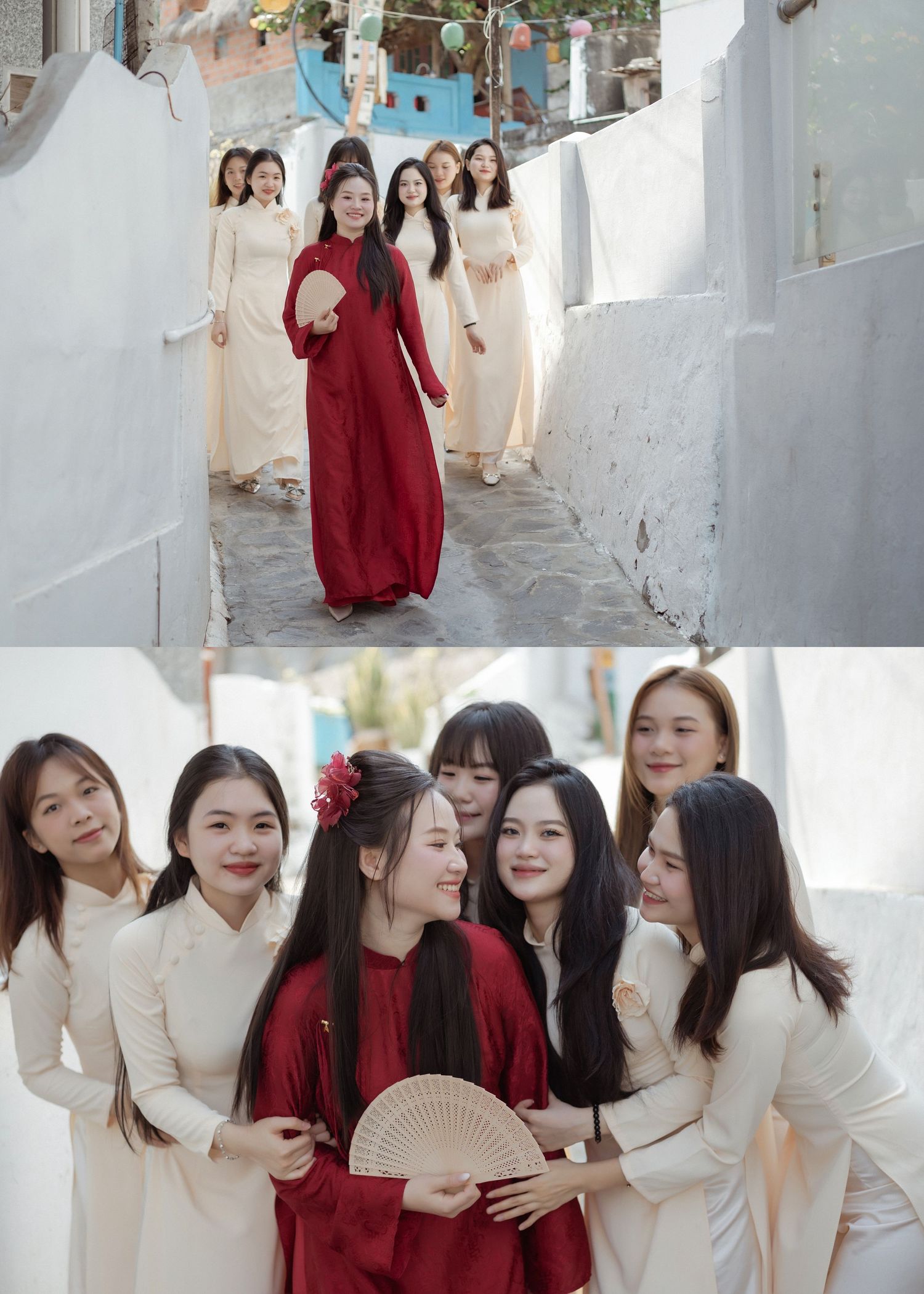 A group in traditional Vietnamese clothing poses together in a narrow alleyway with white walls.