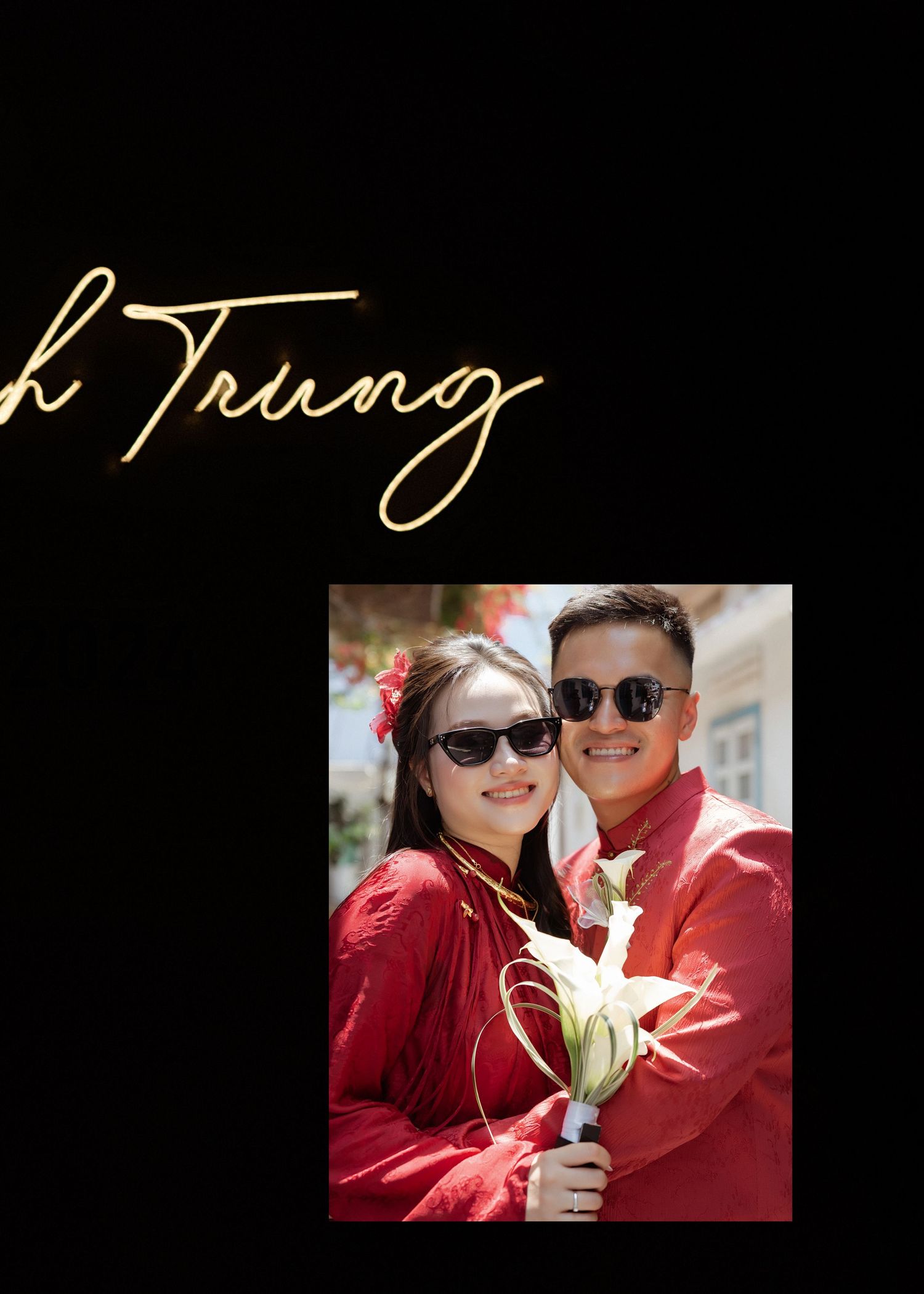 A couple in matching red outfits pose together outdoors with a white lily flower and cursive text overlay.