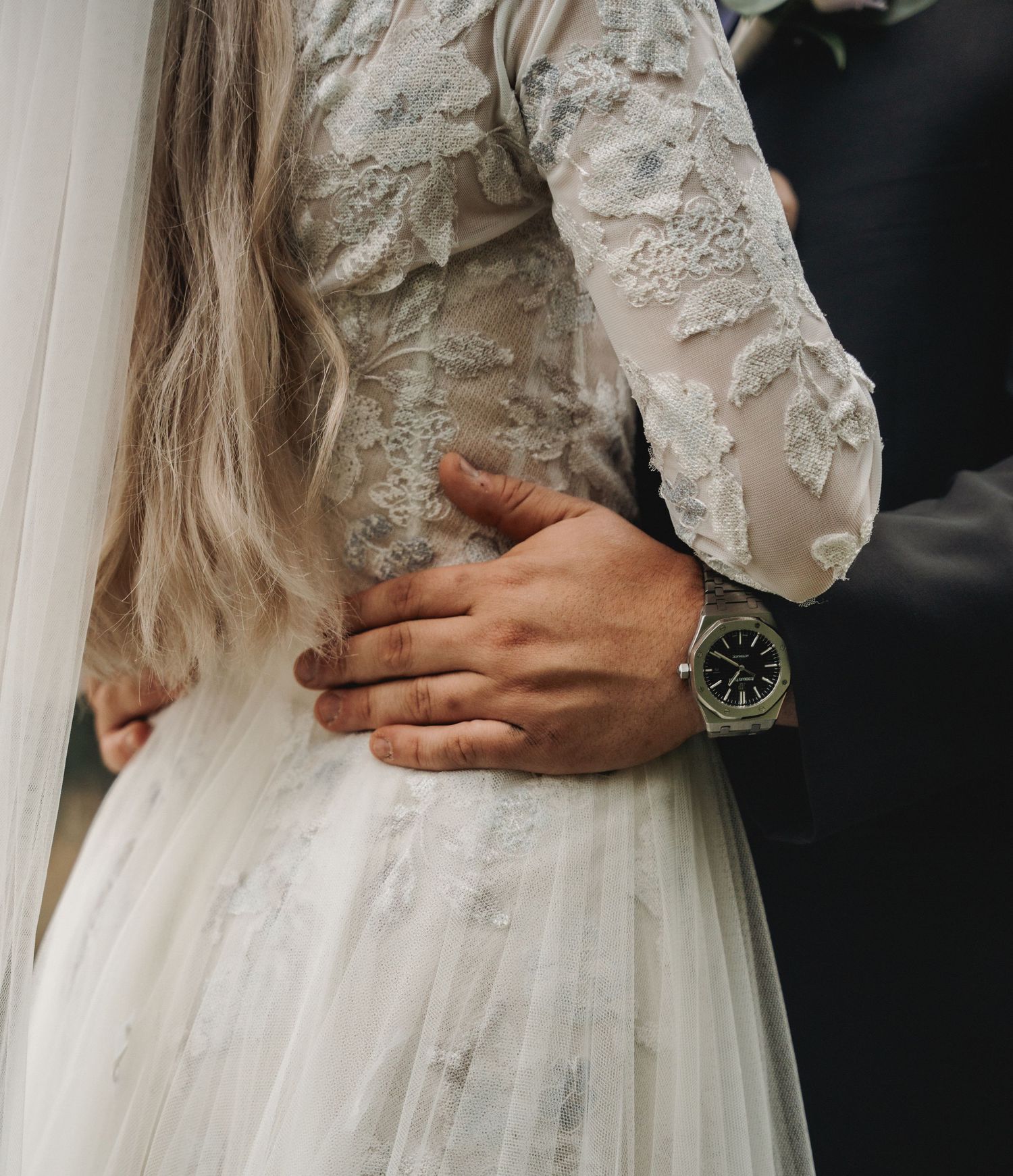 Detail shot of wedding dress bodice with lace and tulle fabric.