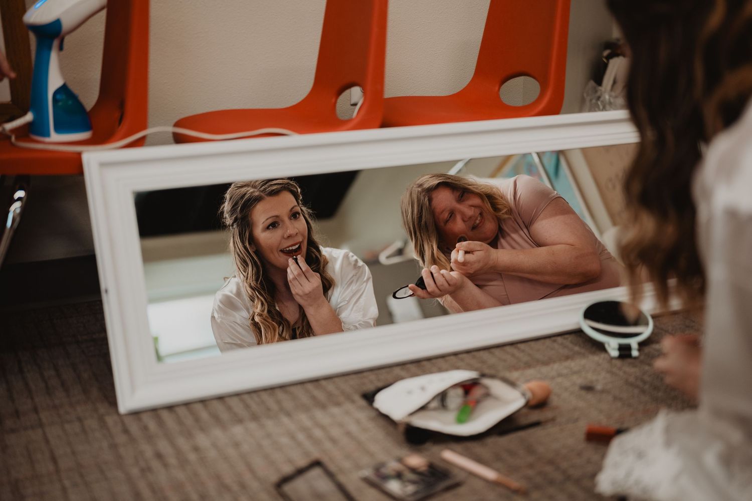 A series of playful engagement photos showing a couple holding hands and laughing together in natural light.