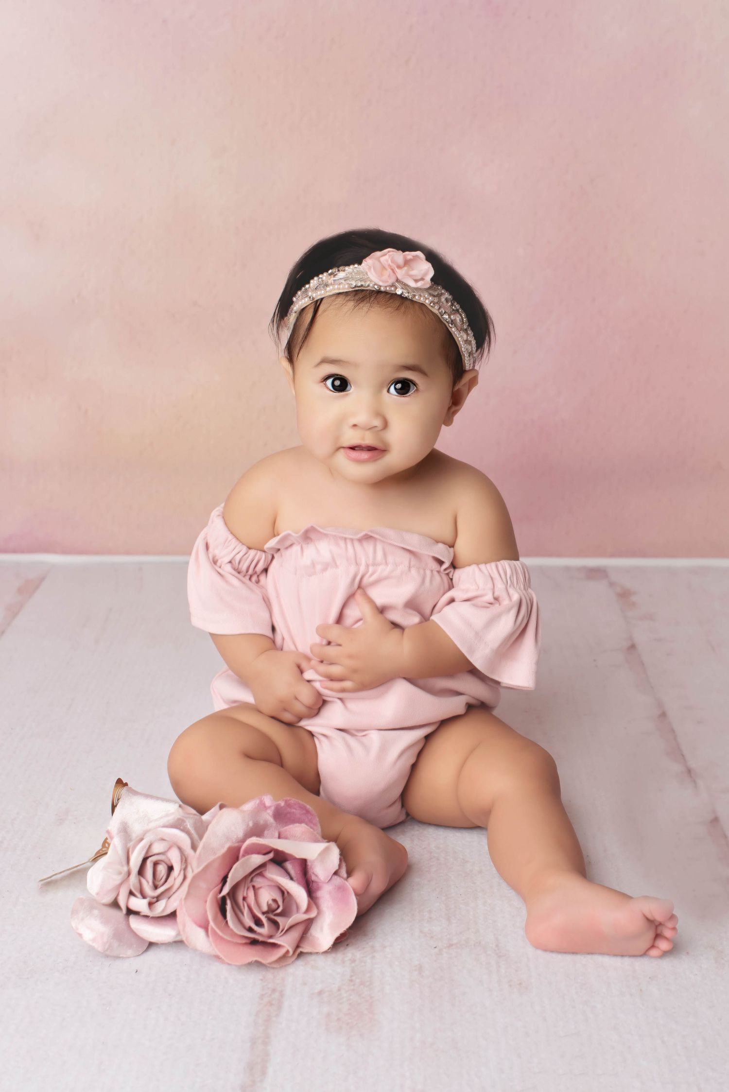 Sweet 1 one year old milestone in pink with wood floor and pink backdrop
