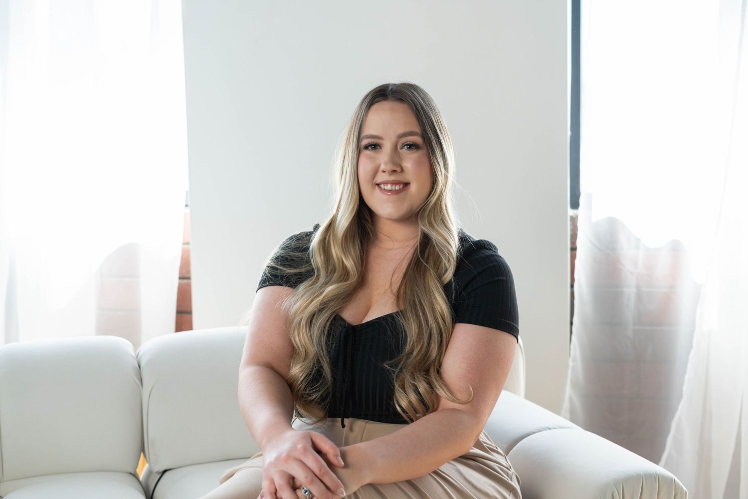 girl with a black blouse and khaki pants