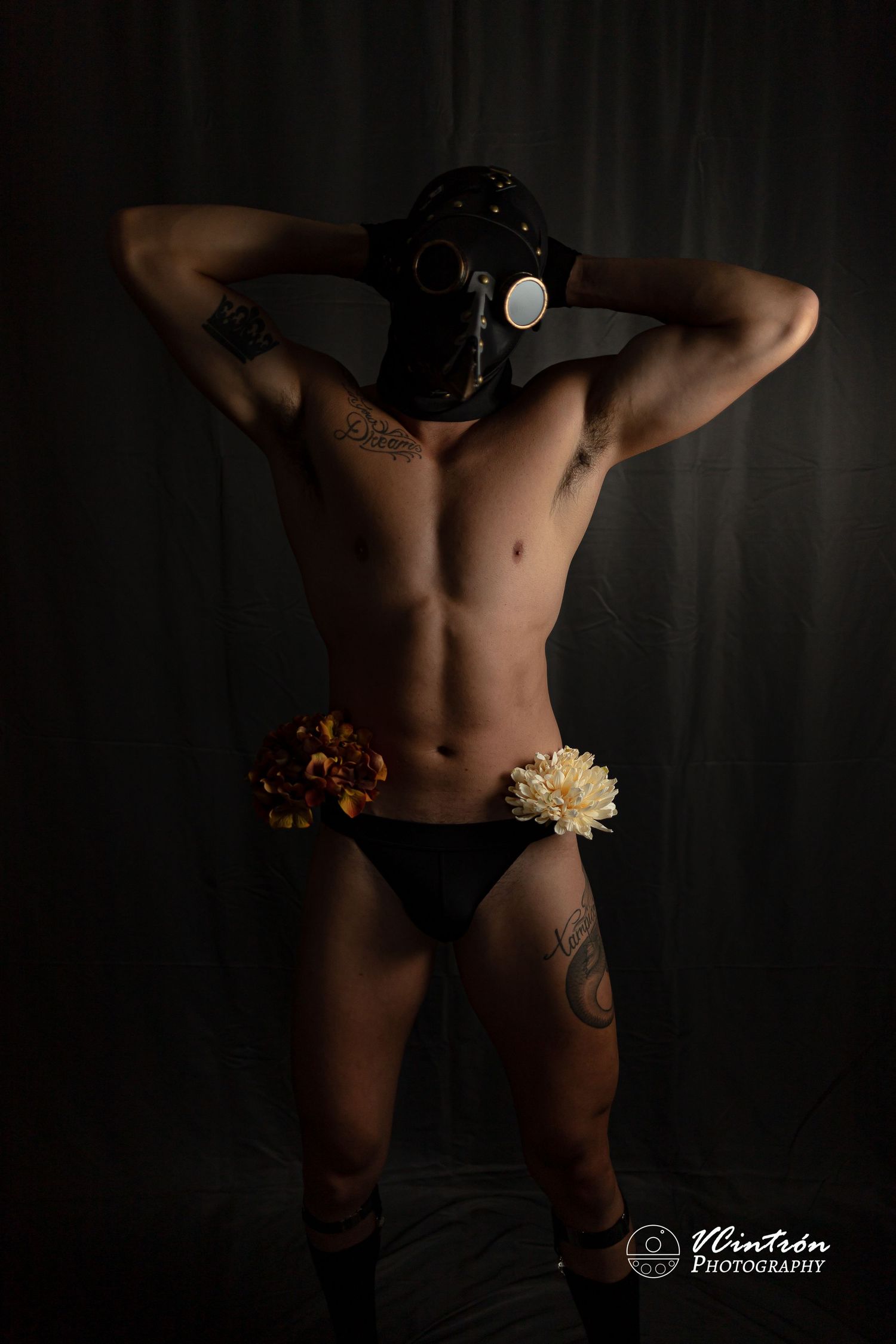 Artistic silhouette photography series showing the human form in shadow against a dark background with floral accents.