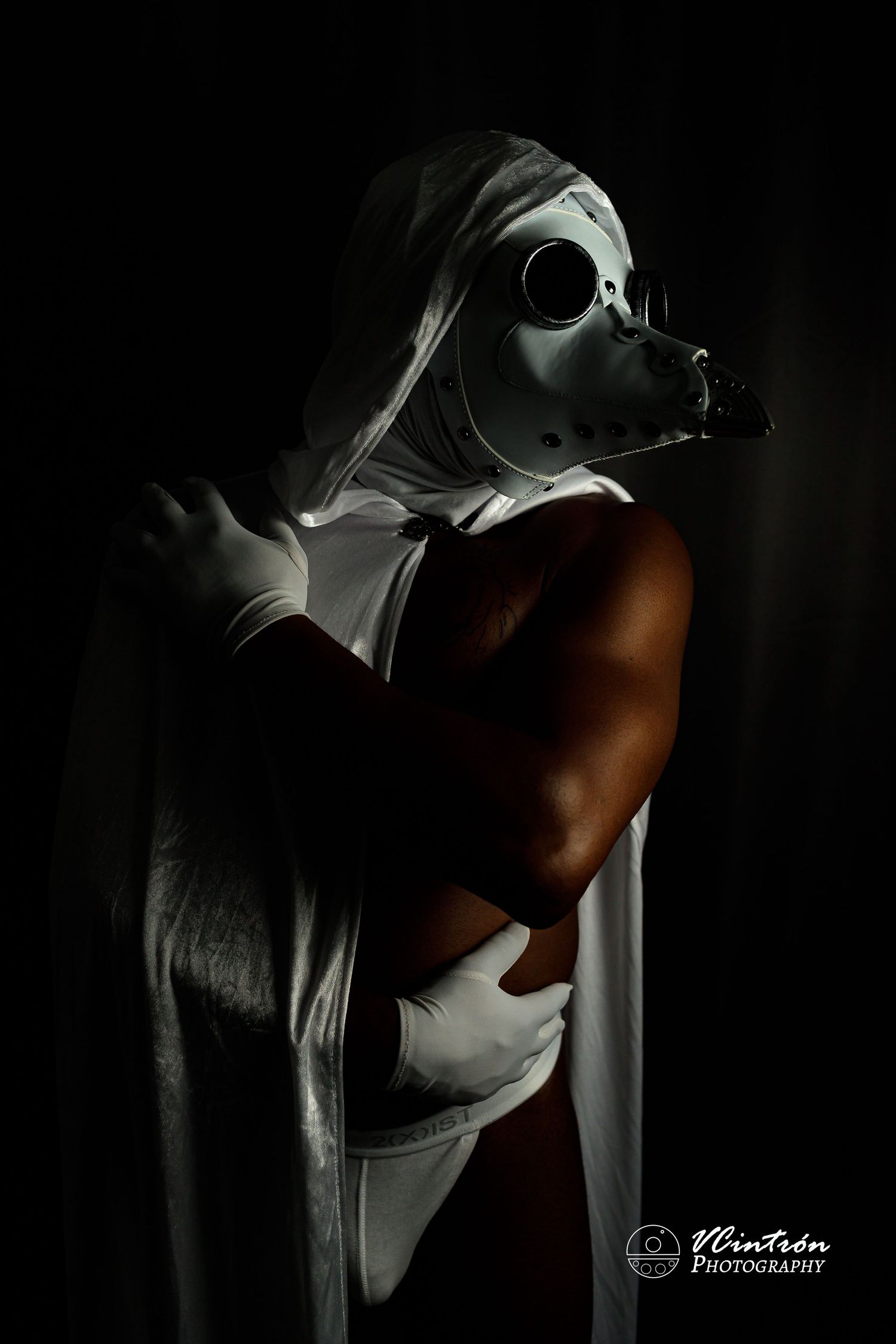 Artistic black and white photographers work showing a repeated sequence of a female figure in shadow against light background.