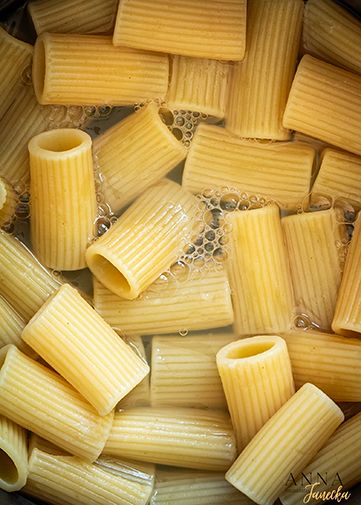 Close-up of uncooked rigatoni pasta noodles arranged in a pattern.