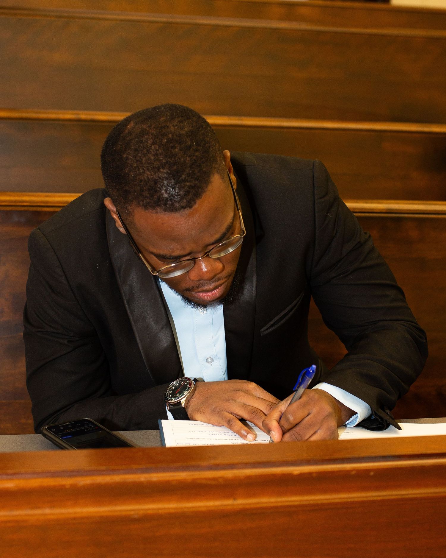 young man signing a contract