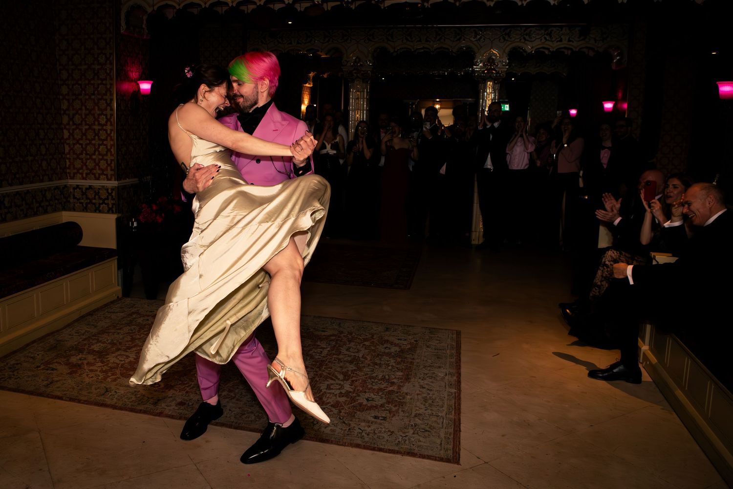 Dancers perform in dim lighting on a dance floor, captured in a sequence of connected action shots.