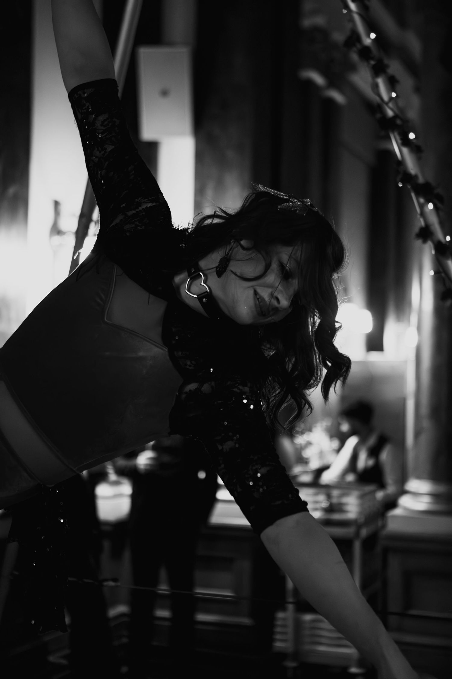 Dark and moody black and white photo series showing movement and dance in silhouette against a window.