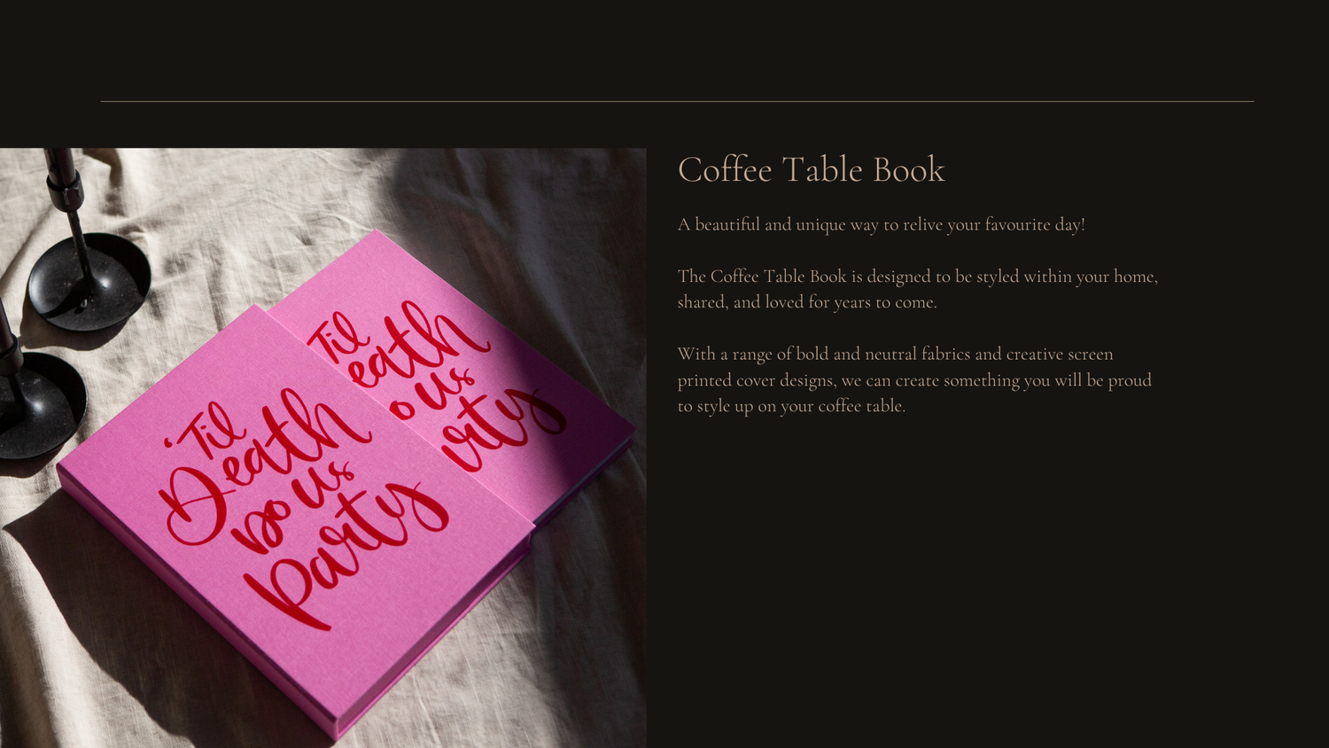 A pink sticky note with handwritten text sits on top of a coffee table book in dramatic lighting.