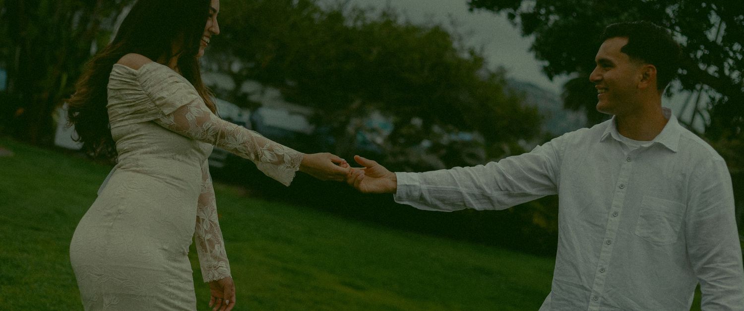 Couple holding hands at Heisler Park.