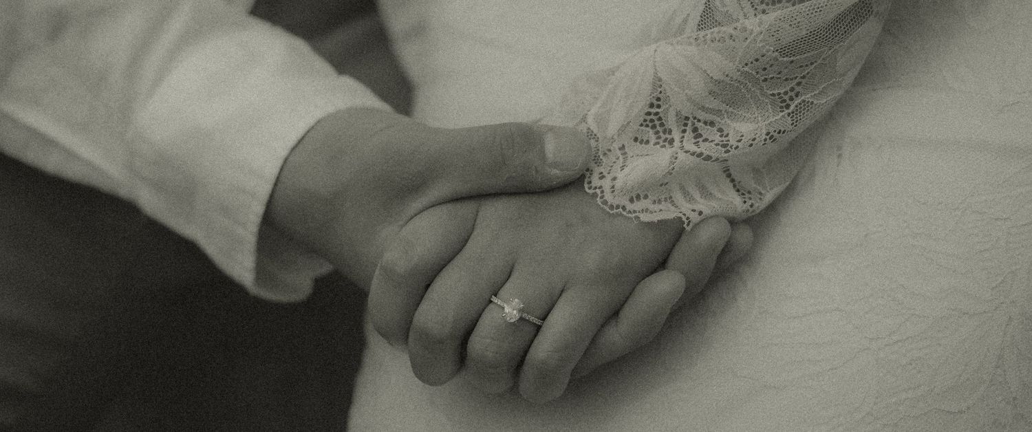 Romantic black and white ring photograph before the couple's Elopement Ceremony at the Laguna Beach Courthouse.