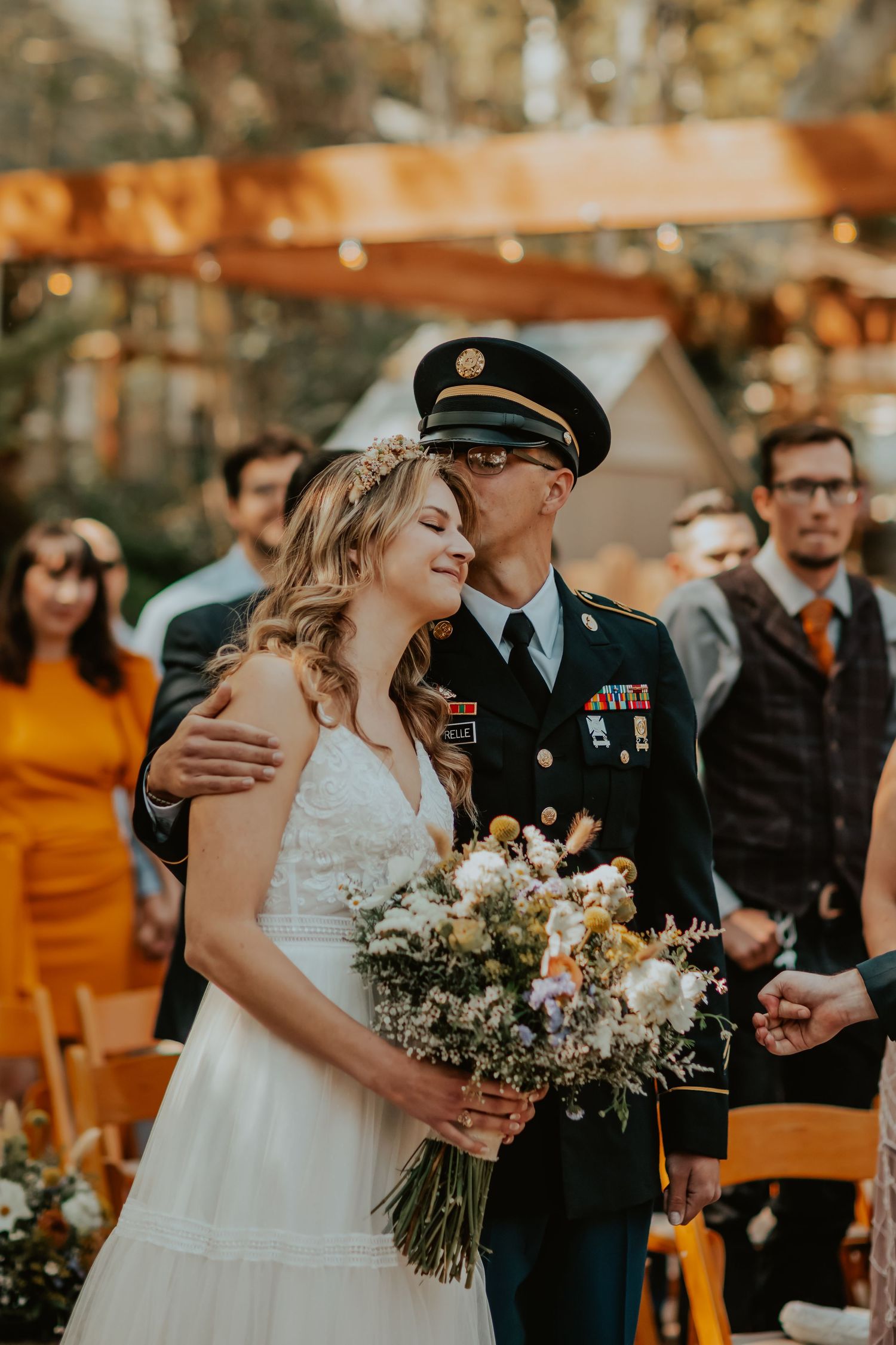 soldier brother gives heartfelt kiss on his sister's head as he gives her away to the groom