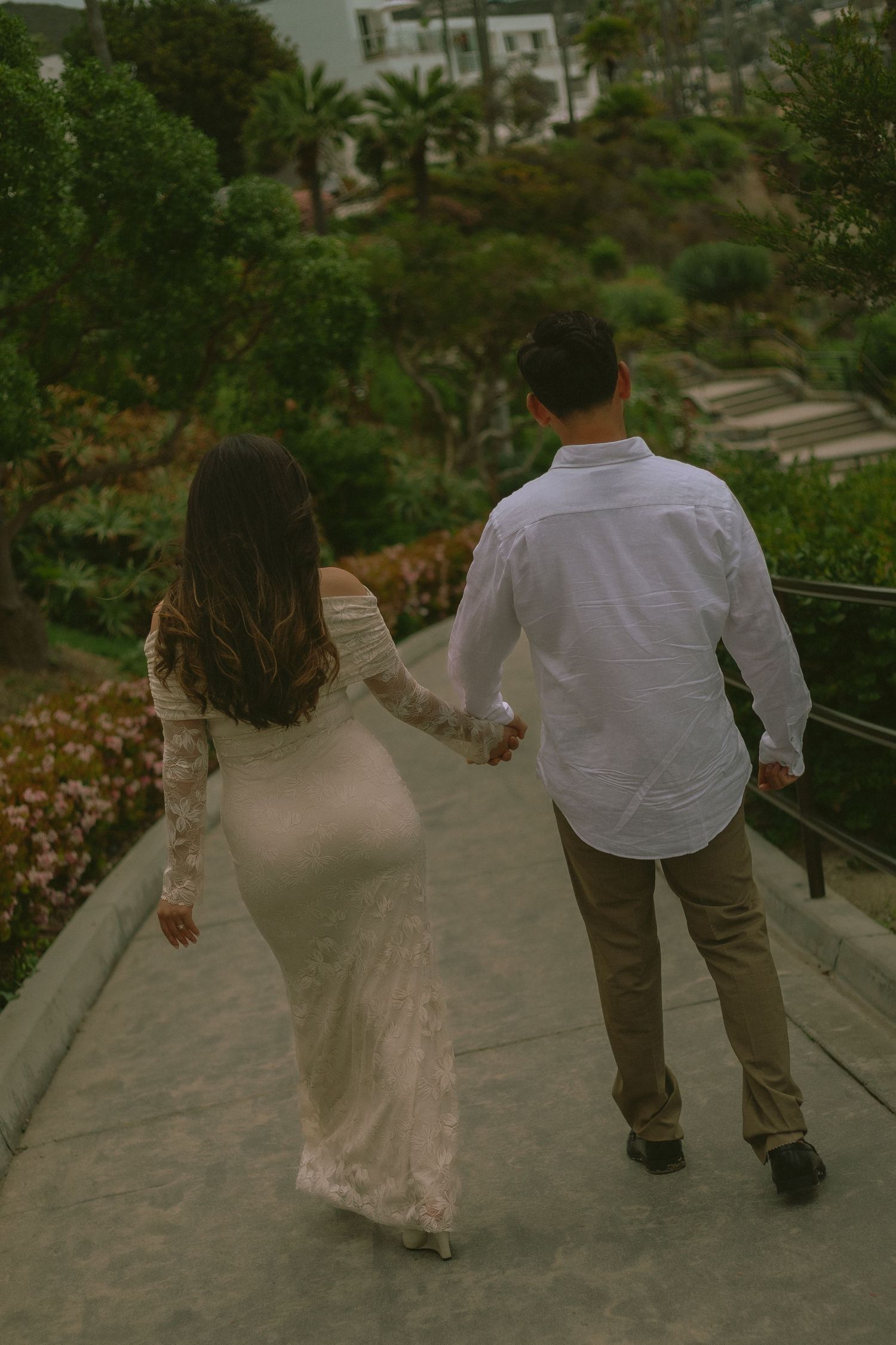 Couple taking a loving stroll near Las Brisas Californian Cuisine in Laguna Beach, California.