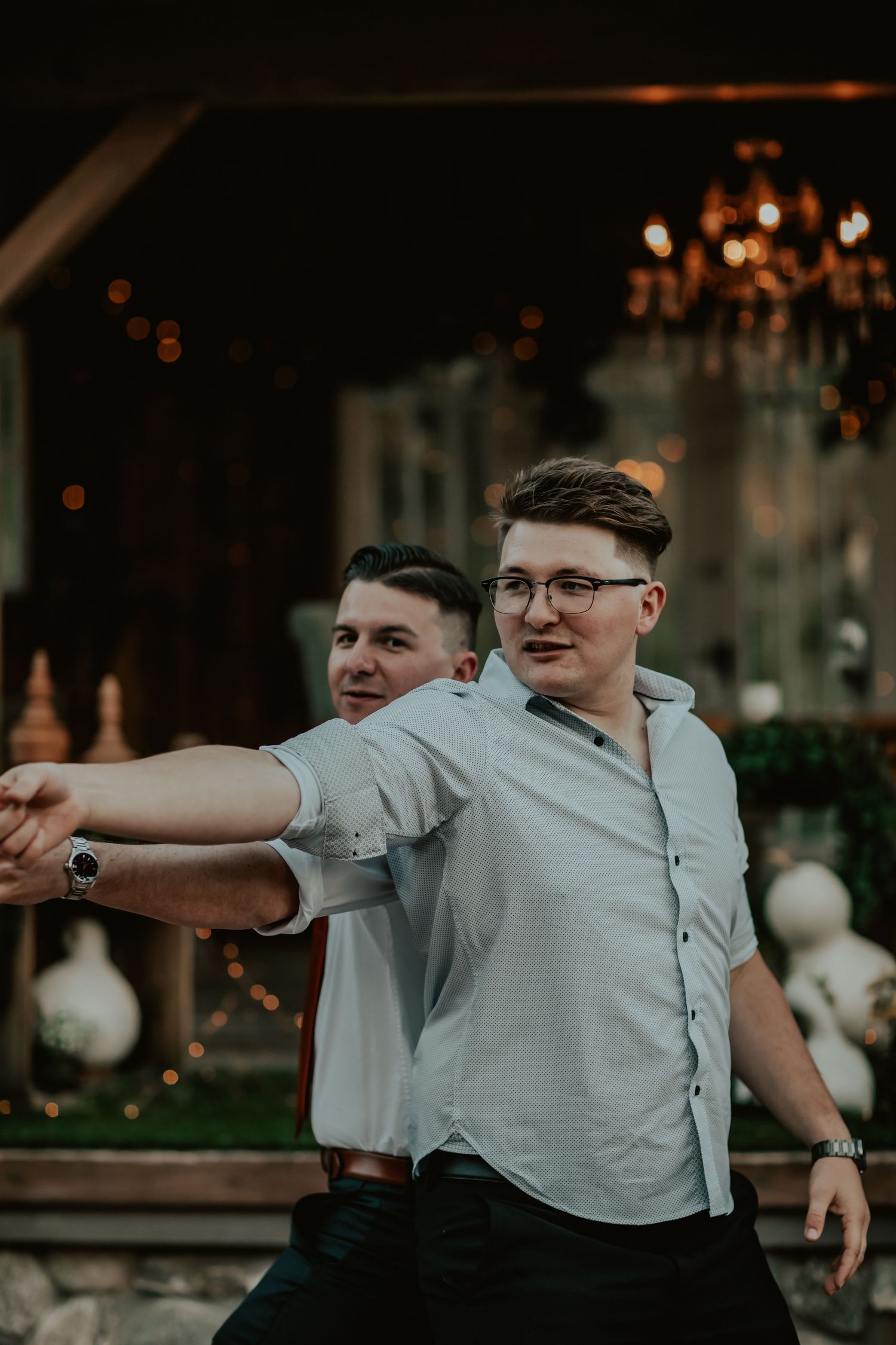 Grooms best friends hysterically dancing together and making guests laugh