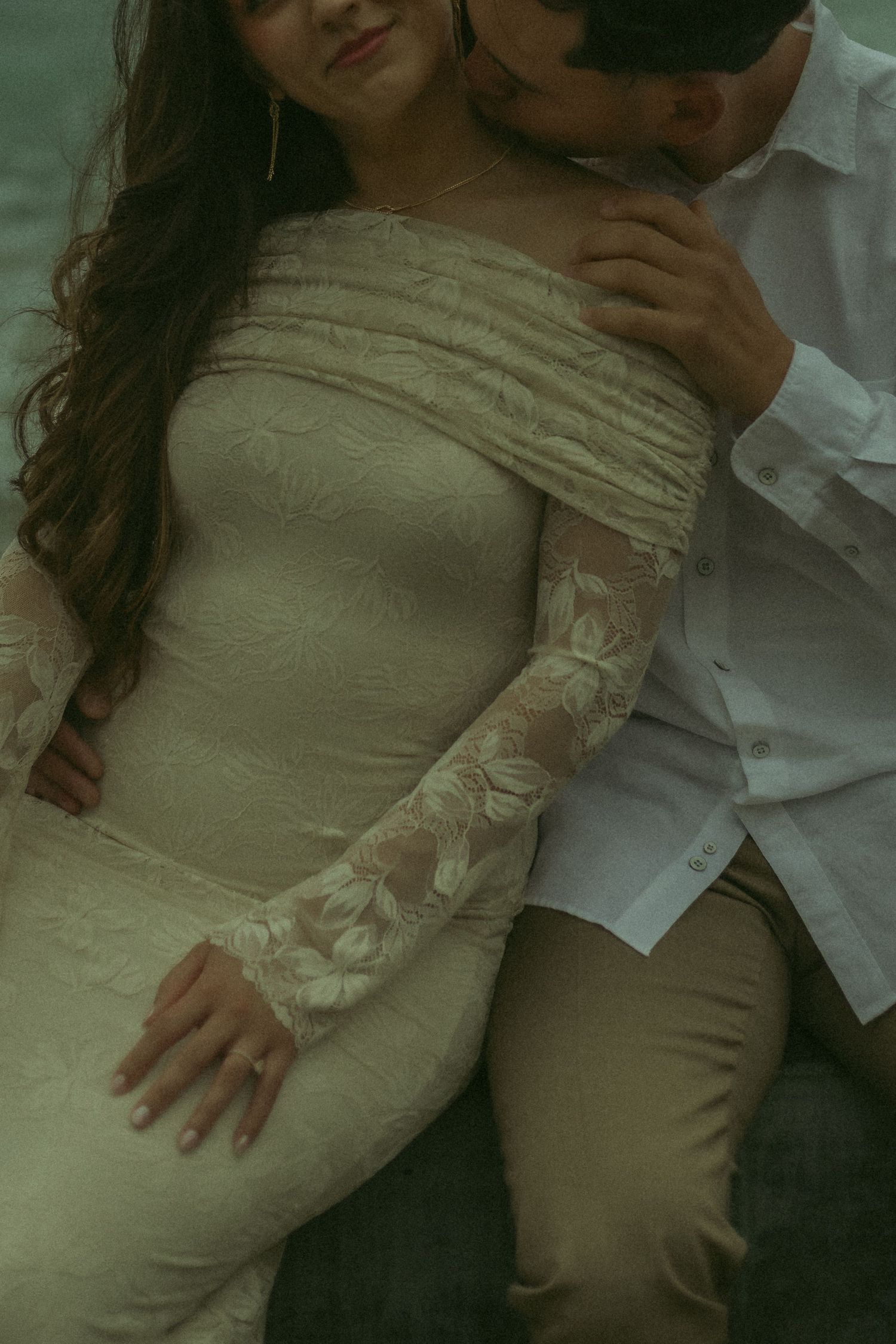 Detailed shot of a husband and wife in a beautiful embrace.