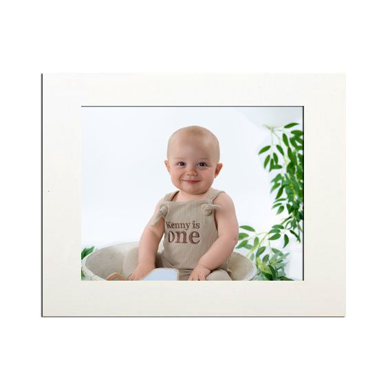 Professional studio photograph displayed in a simple white frame.