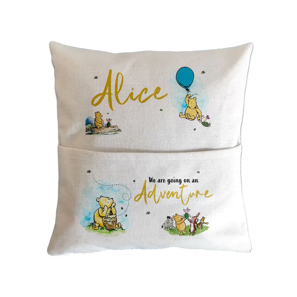 Custom decorative pillow with Winnie the Pooh themed illustrations and the name Alice in gold lettering.